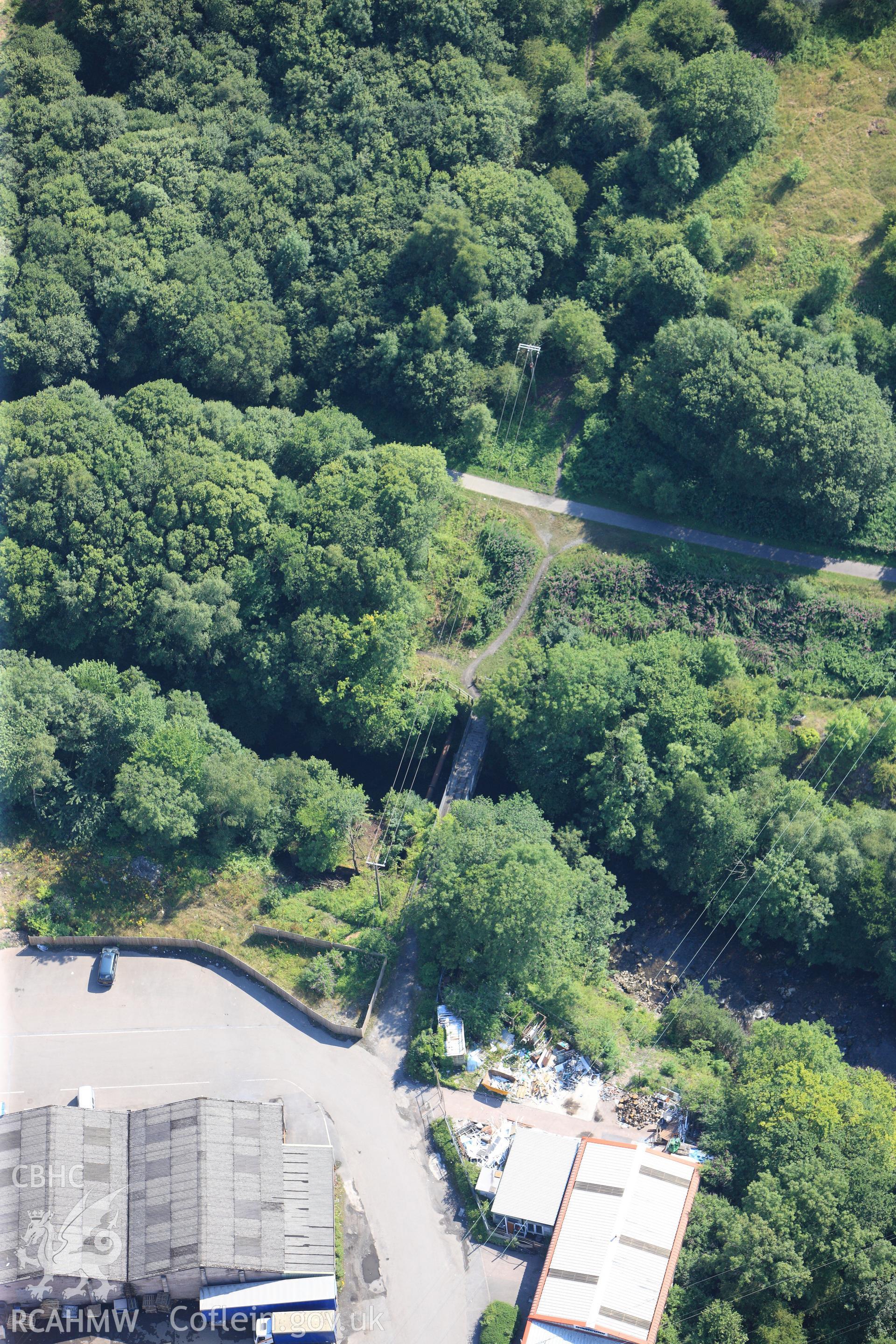 Pont-y-Cafnau over the river Taff, in western Merthyr Tydfil. Oblique aerial photograph taken during the Royal Commission?s programme of archaeological aerial reconnaissance by Toby Driver on 1st August 2013.