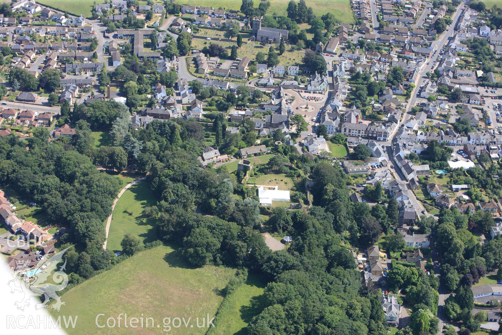 St. Mary's Church and Usk Castle, Usk. Oblique aerial photograph taken during the Royal Commission?s programme of archaeological aerial reconnaissance by Toby Driver on 1st August 2013.