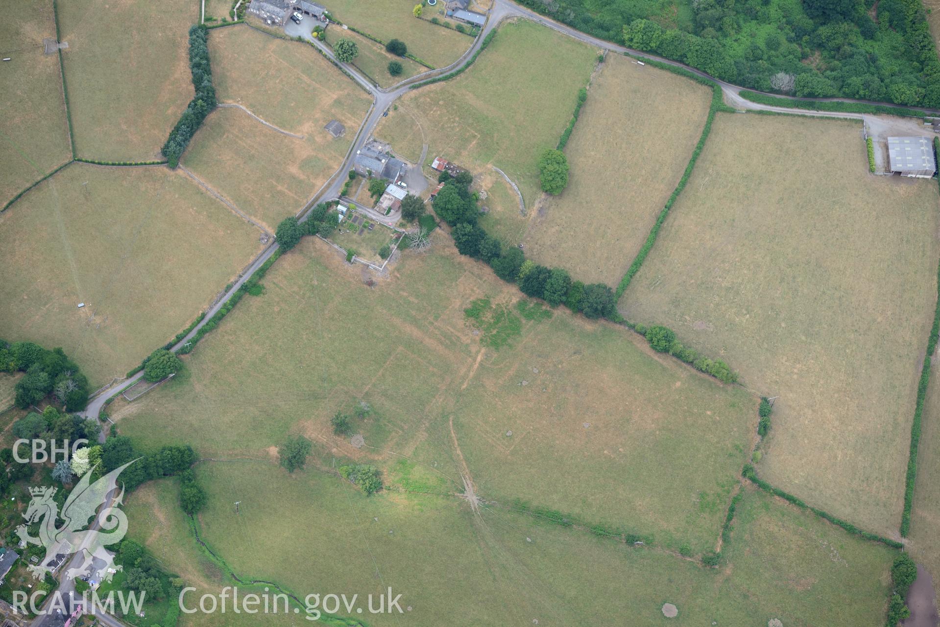 Royal Commission aerial photography of extensive parchmarks at Pen y Gaer Roman fort, including the internal plan and extramural buildings, taken on 19th July 2018 during the 2018 drought.