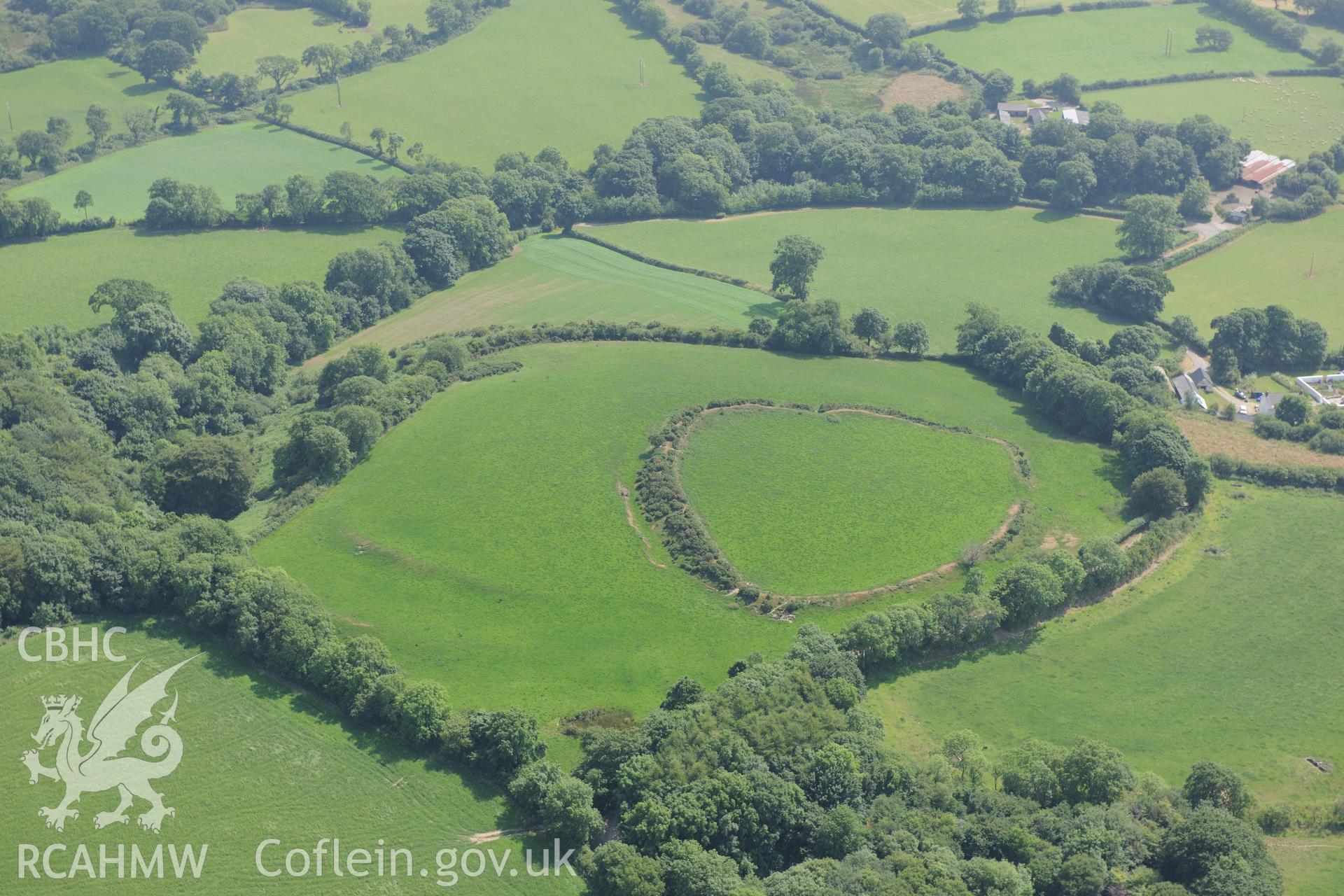 Caerau Gaer hillfort, north east of Narberth. Oblique aerial photograph taken during the Royal Commission?s programme of archaeological aerial reconnaissance by Toby Driver on 16th July 2013.