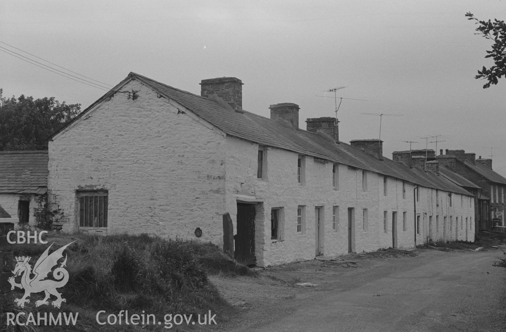 Digital copy of black & white negative showing view looking towards crossroads past the row of cottages on Cwmsaeson Road at Oakford, Aberaeron. Photograph by Arthur O. Chater, 5th September 1966, looking south south west from Grid Reference SN 453 581.