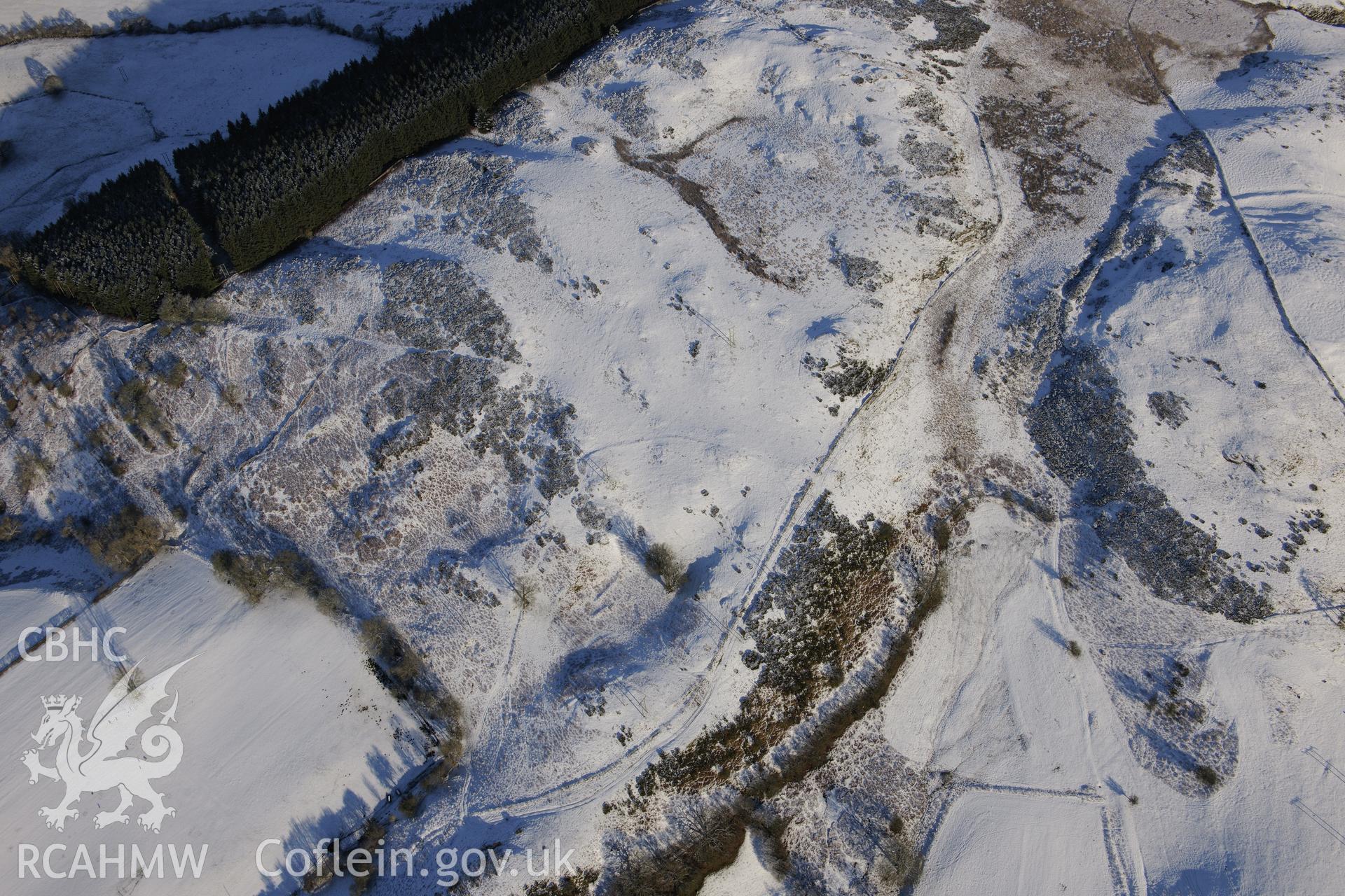 House platforms west of Gaer Fawr, north east of Builth Wells. Oblique aerial photograph taken during the Royal Commission?s programme of archaeological aerial reconnaissance by Toby Driver on 15th January 2013.