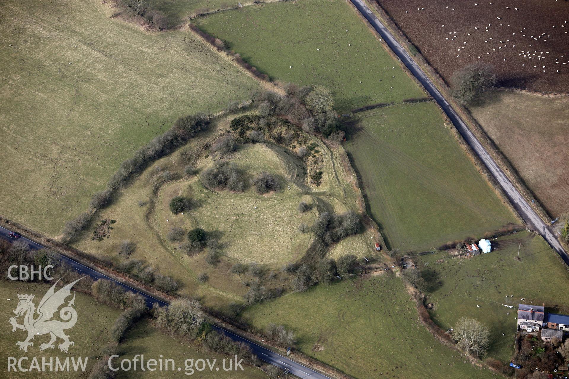 Tomen-y-Rhodwydd motte and bailey, Llandegla, south east of Ruthin. Oblique aerial photograph taken during the Royal Commission?s programme of archaeological aerial reconnaissance by Toby Driver on 28th February 2013.