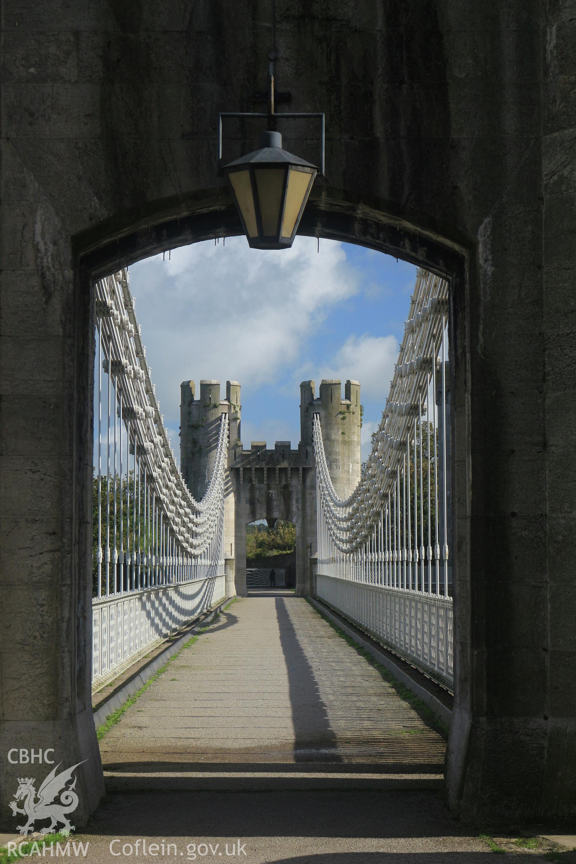 Investigator Photographs of Conwy Suspension Bridge. View along the bridge through the tower gate on the castle side.