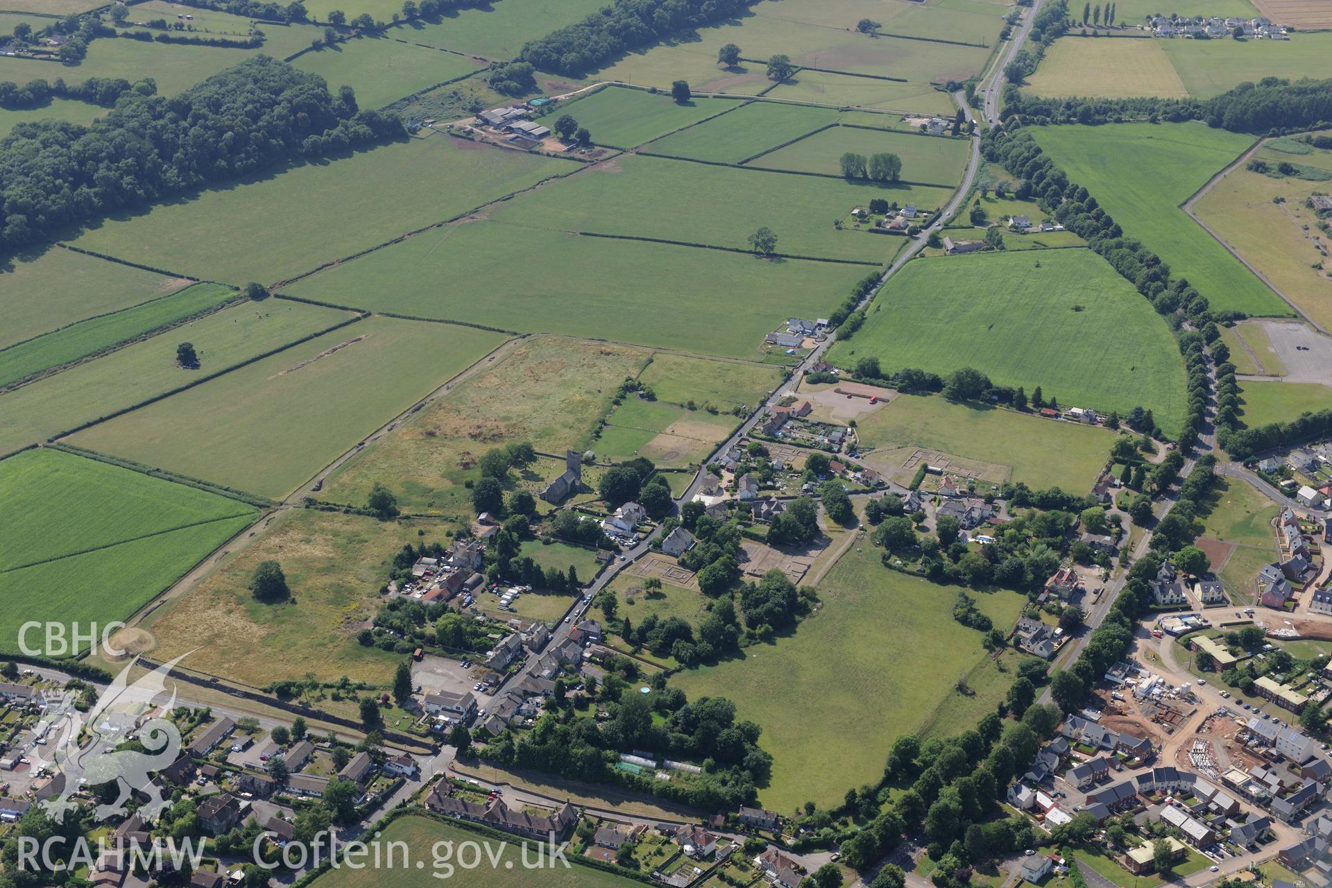 St. Stephen's church, Roman Amphitheatre and Venta Silurum (Caerwent Roman City), Caerwent, near Chepstow. Oblique aerial photograph taken during the Royal Commission?s programme of archaeological aerial reconnaissance by Toby Driver on 1st August 2013.