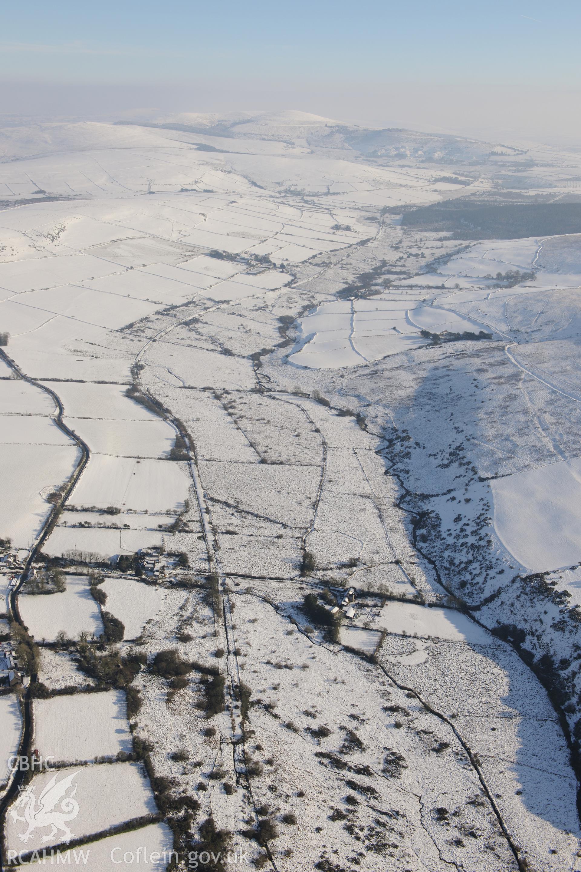 Landscape around St John the Baptist's church, Morvil, Puncheston, in the foothills of the Preseli mountains. Oblique aerial photograph taken during the Royal Commission?s programme of archaeological aerial reconnaissance by Toby Driver on 24th January 2013.
