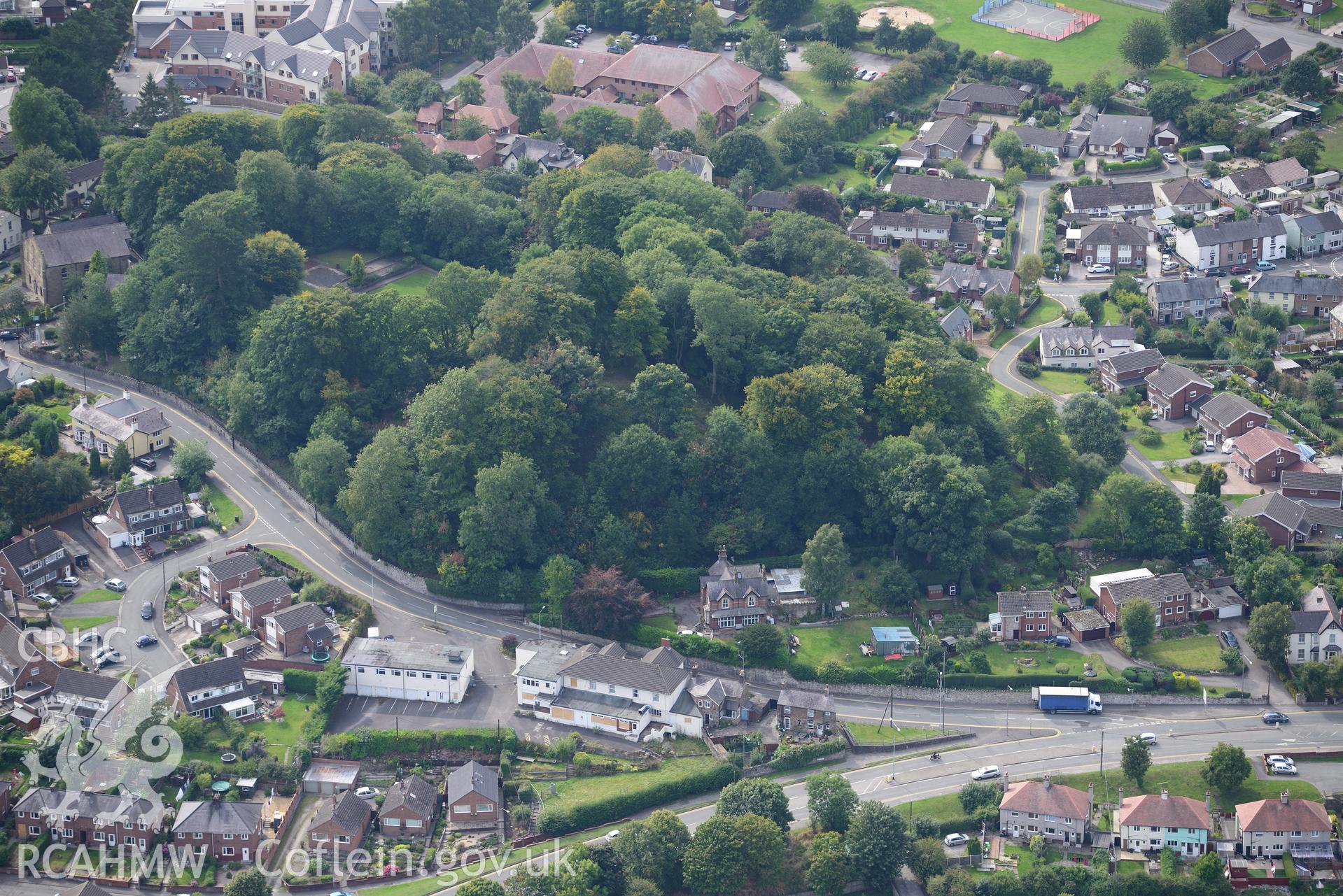 Mold castle and the surrounding town, Mold. Oblique aerial photograph taken during the Royal Commission's programme of archaeological aerial reconnaissance by Toby Driver on 11th September 2015.