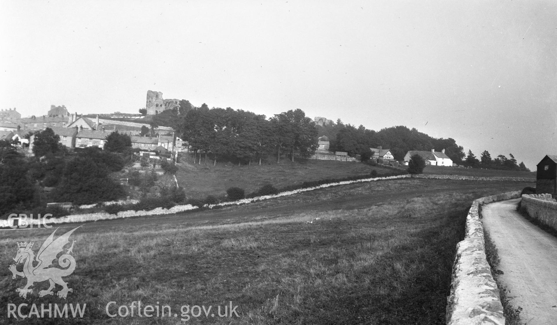 Digital copy of a nitrate negative showing view of Denbigh town and castle taken by Leonard Monroe, undated.