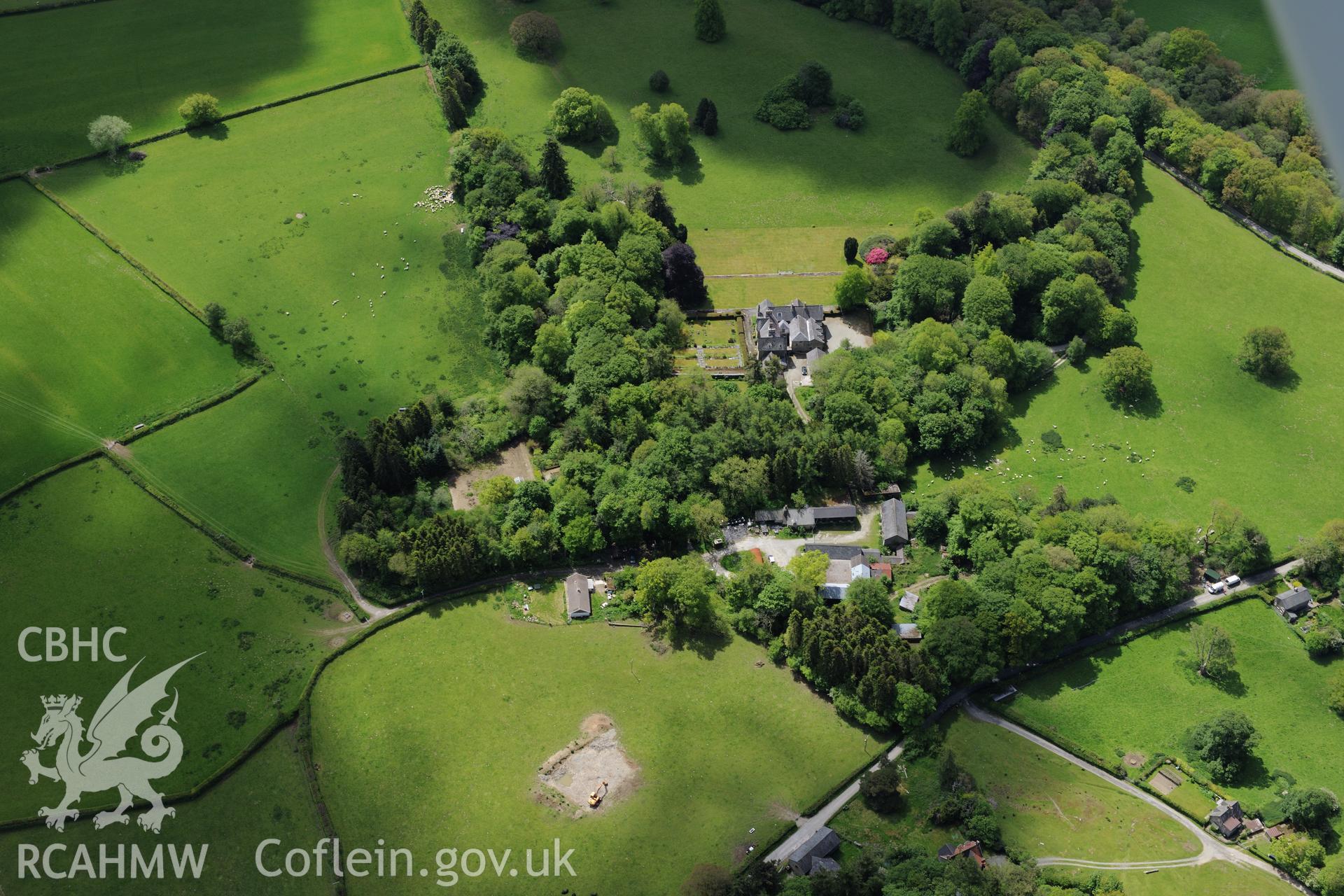 Derw country house and garden and Derw home farm including cowhouse, barn, sawmill, stable and cartshed. Oblique aerial photograph taken during the Royal Commission's programme of archaeological aerial reconnaissance by Toby Driver on 3rd June 2015.