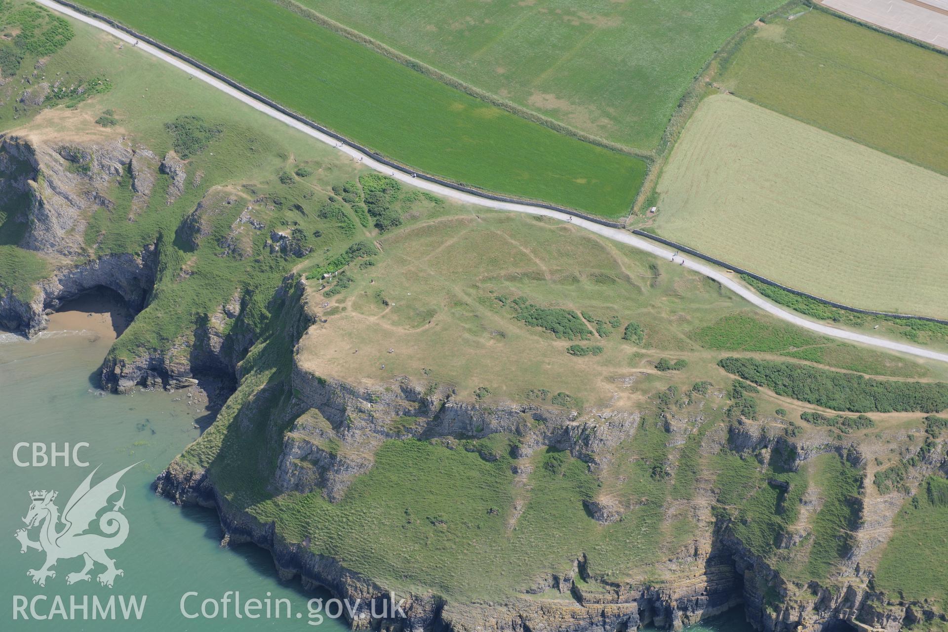 Old Castle Promontory Fort, Rhossili. Oblique aerial photograph taken during the Royal Commission?s programme of archaeological aerial reconnaissance by Toby Driver on 16th July 2013.