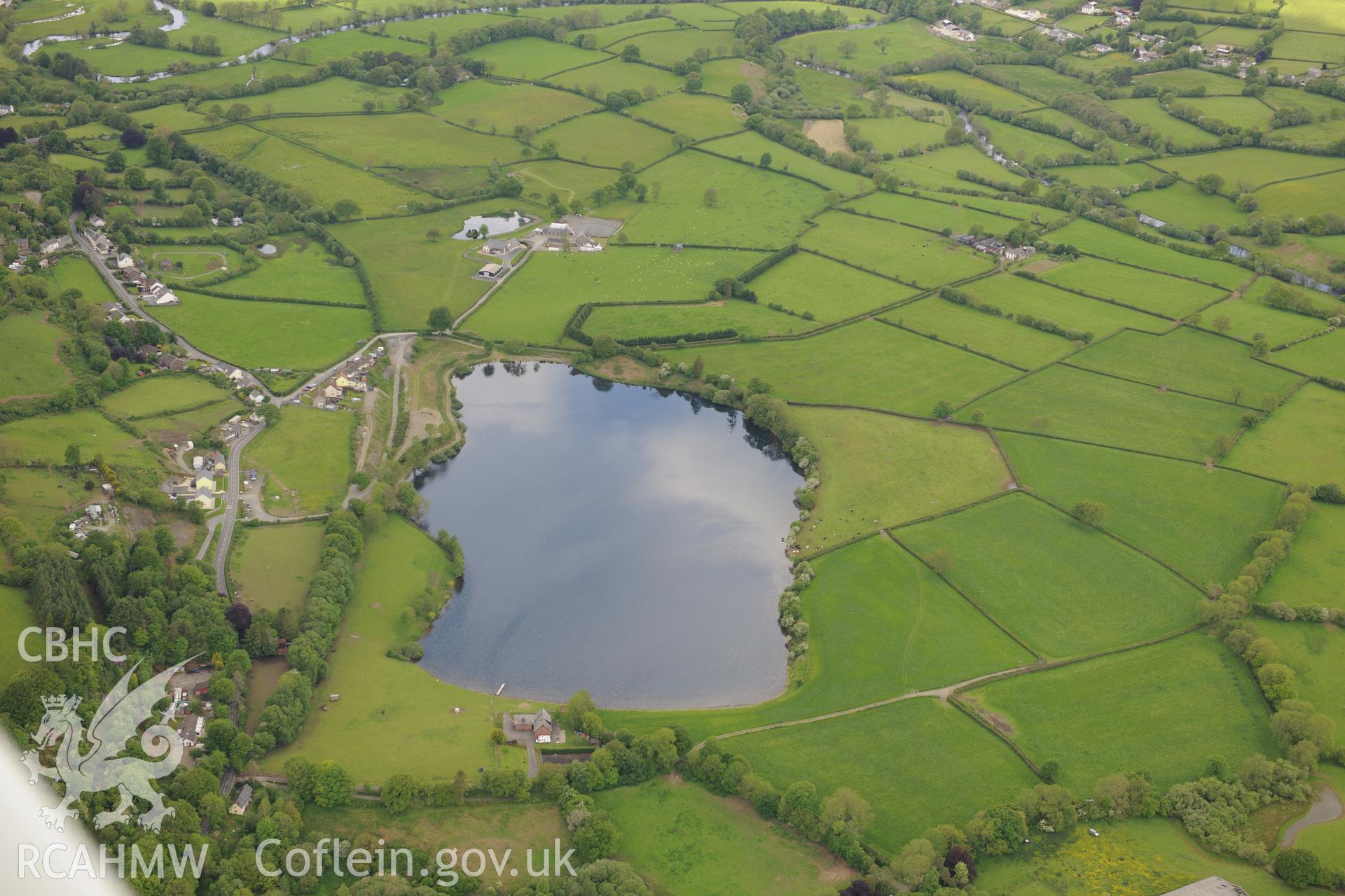 Roman mace find and railway halt at Llyn Pencarreg. Oblique aerial photograph taken during the Royal Commission's programme of archaeological aerial reconnaissance by Toby Driver on 3rd June 2015.