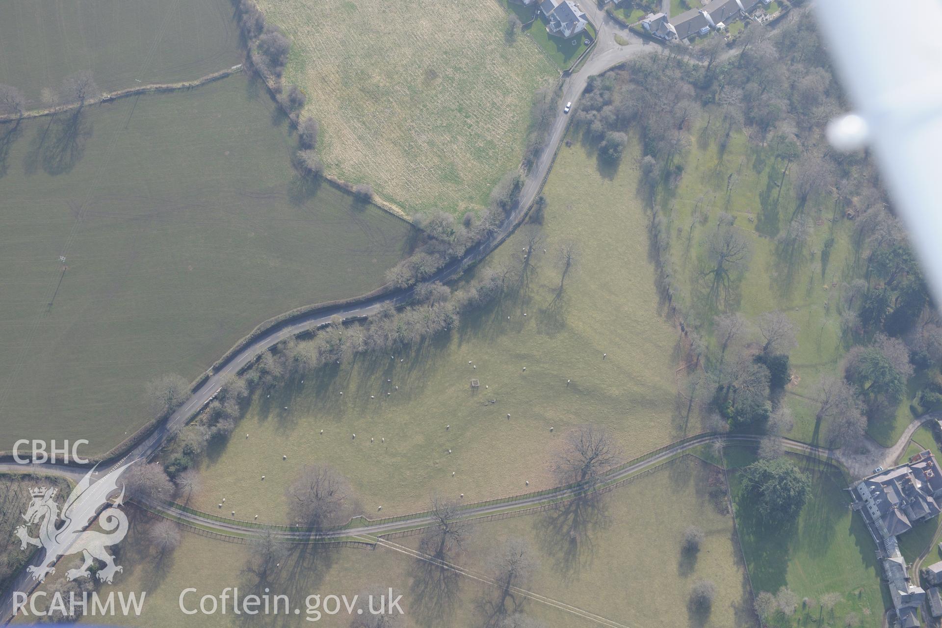 Garn house and Garn earthworks, Henllan, north west of Denbigh. Oblique aerial photograph taken during the Royal Commission?s programme of archaeological aerial reconnaissance by Toby Driver on 28th February 2013.