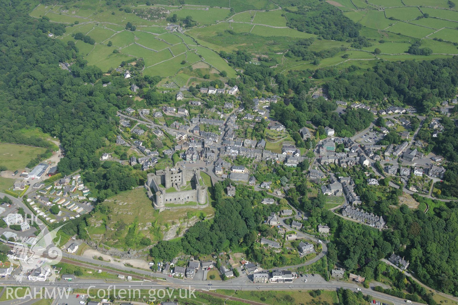 Harlech Castle, overlooking Harlech. Oblique aerial photograph taken during the Royal Commission?s programme of archaeological aerial reconnaissance by Toby Driver on 12th July 2013.