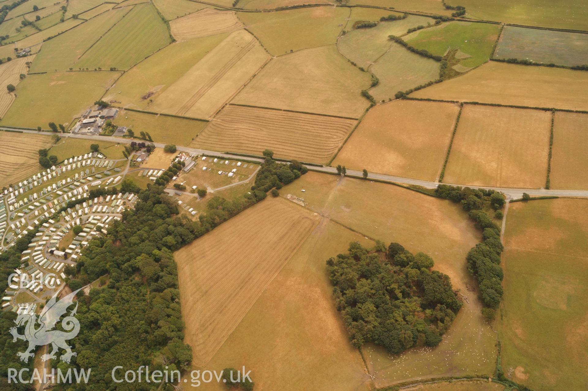 Wide shot aerial photograph of Square Barrow Cemetery & cropmarks near Ynysmaengwyn, taken by Glyn Davies & Jonathan Brentnall 16/07/2018 under drought conditions. Original Photograph. For modified version with archaeology highlighted see BDC_04_03_01.