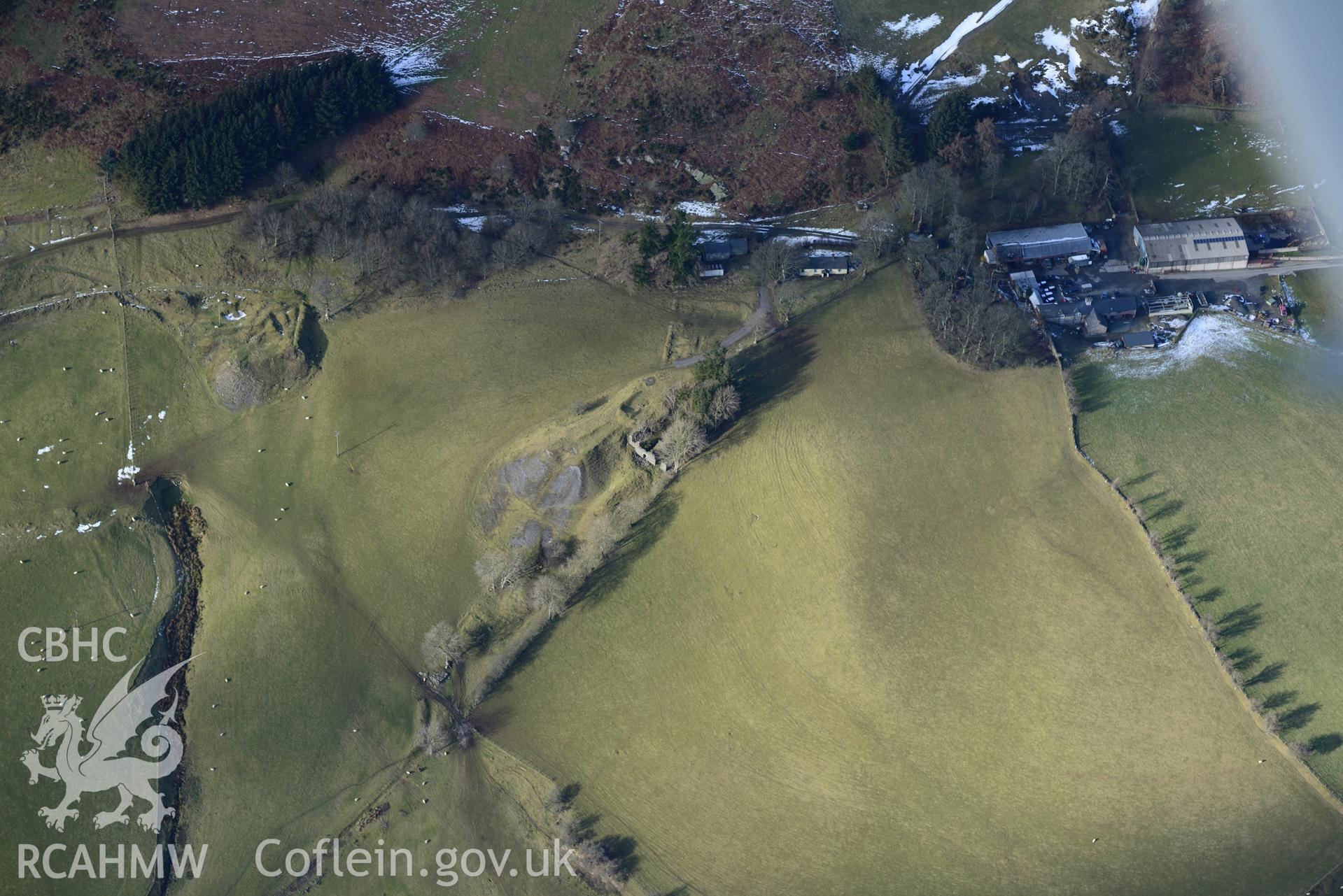 Remains of Bryntail mine at Bryntail Cottage farm, north west of Llanidloes. Oblique aerial photograph taken during the Royal Commission's programme of archaeological aerial reconnaissance by Toby Driver on 4th February 2015.