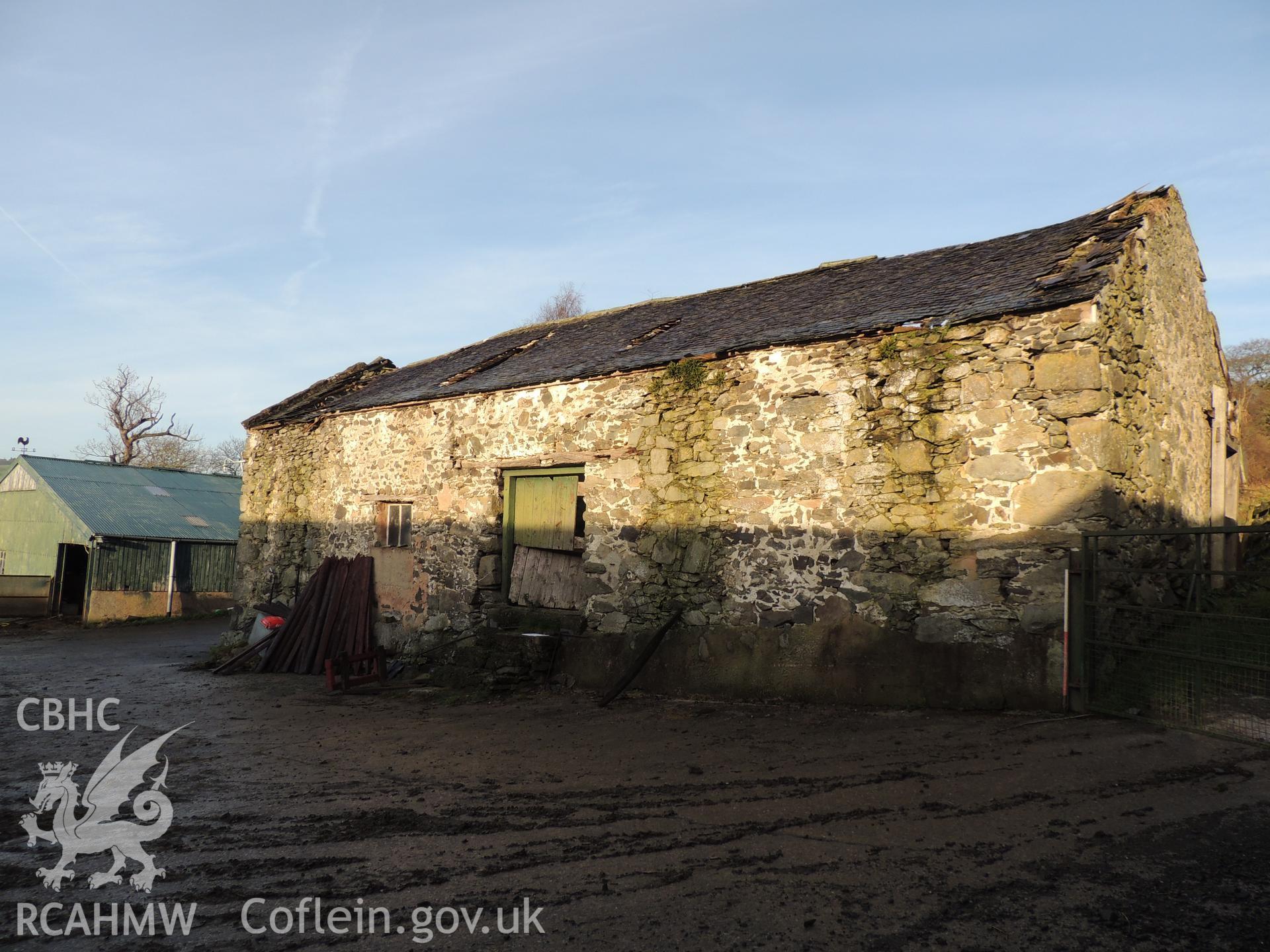 View of front elevation, looking north west. Photograph taken as part of archaeological building survey conducted at Bryn Gwylan Threshing Barn, Llangernyw, Conwy, carried out by Archaeology Wales, 2017-2018. Report no. 1640. Project no. 2578.