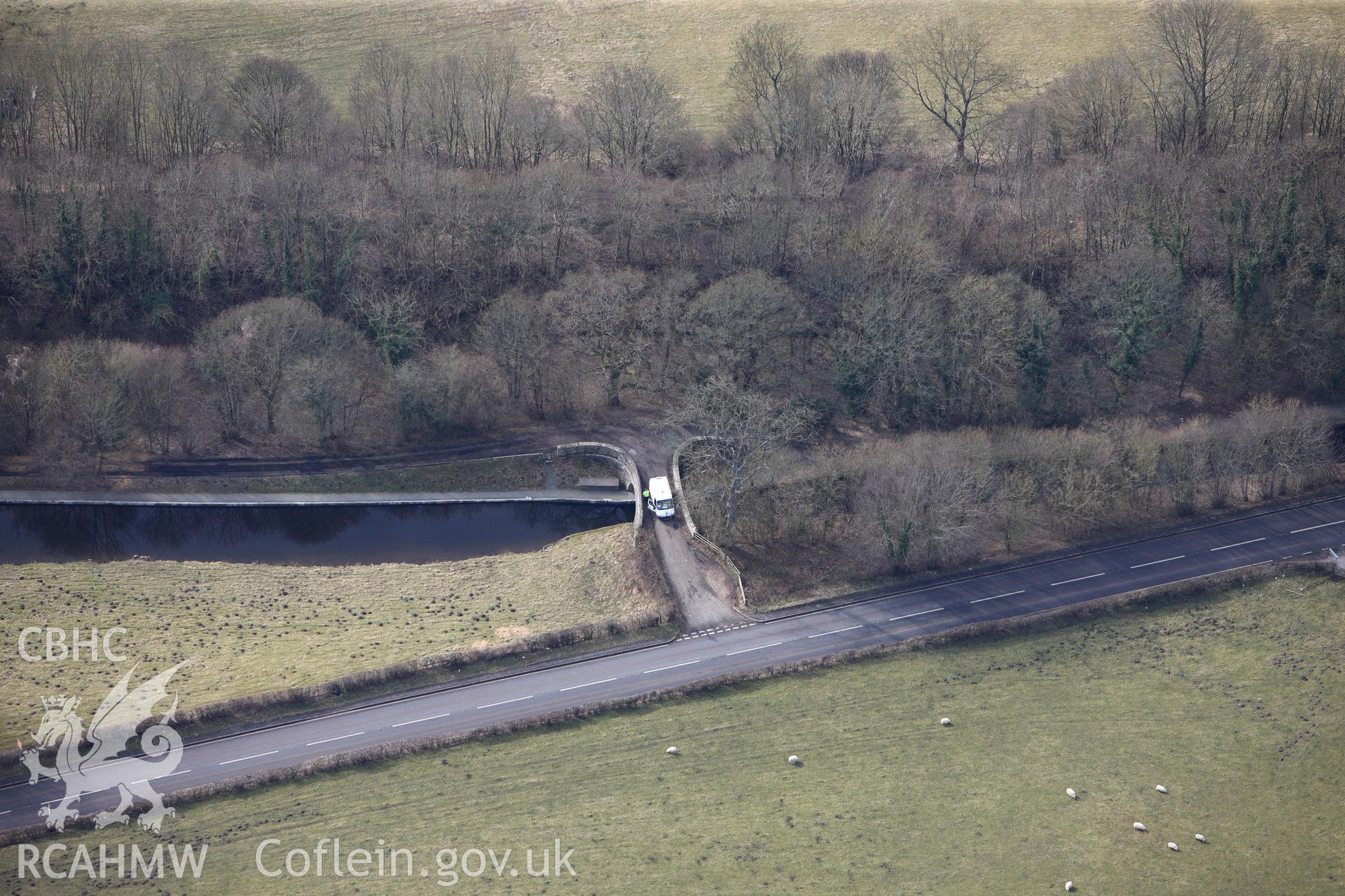 Plas-Ifan Bridge no. 40, crossing the Llangollen canal east of Llangollen. Oblique aerial photograph taken during the Royal Commission?s programme of archaeological aerial reconnaissance by Toby Driver on 28th February 2013.