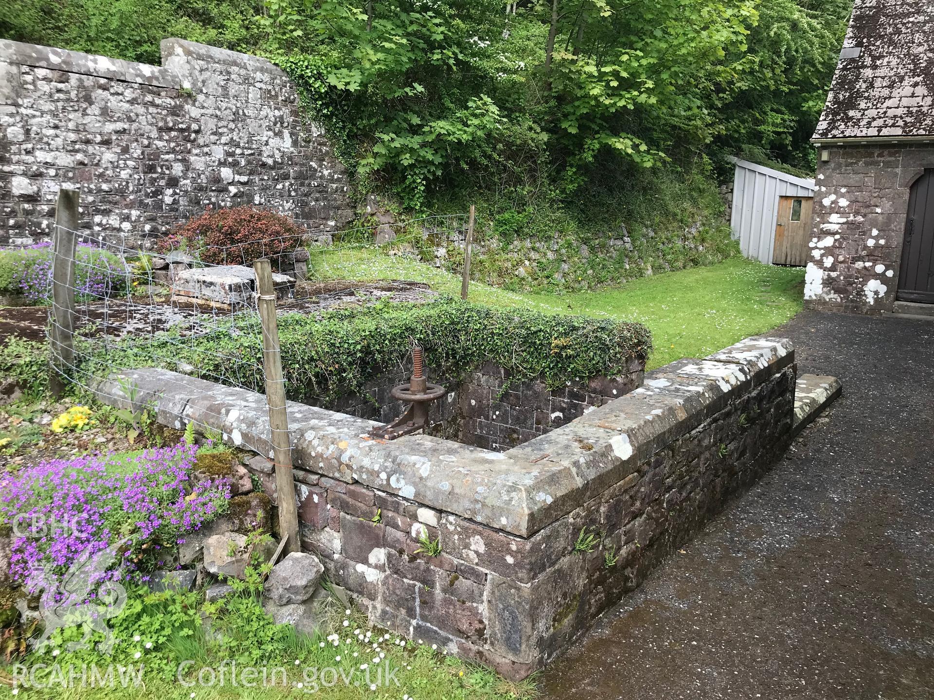 Digital colour photograph showing St Dyfan's well at St Dyfan's Church, Llandyfan, taken by Paul R. Davis on 7th May 2019.