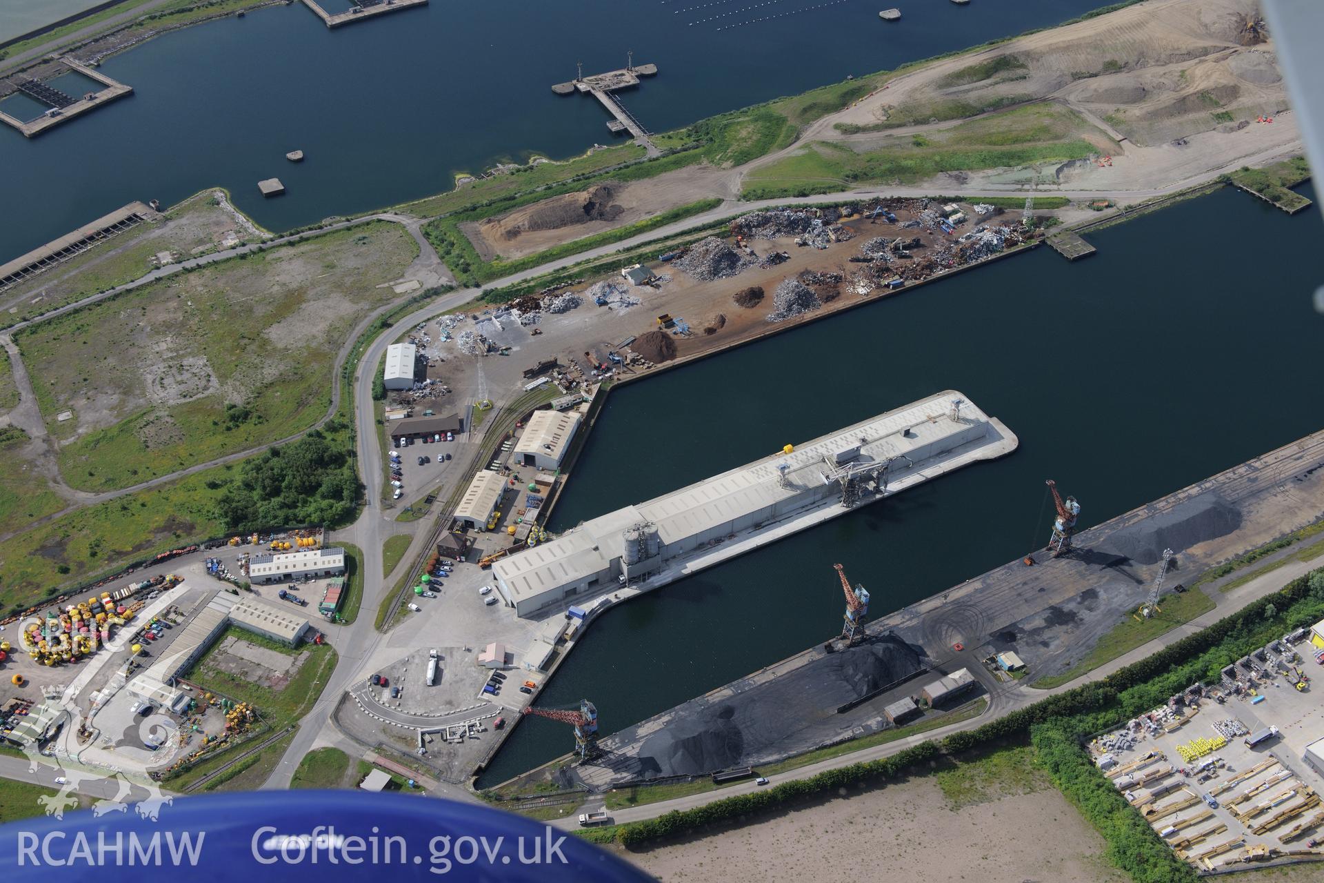 Workshops around the King's and Queen's docks at Swansea Docks. Oblique aerial photograph taken during the Royal Commission's programme of archaeological aerial reconnaissance by Toby Driver on 19th June 2015.