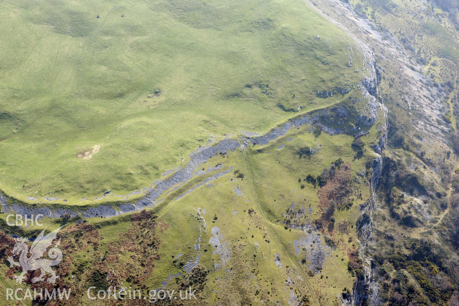 Pen-y-Corddyn-Mawr hillfort, Abergele. Oblique aerial photograph taken during the Royal Commission?s programme of archaeological aerial reconnaissance by Toby Driver on 28th February 2013.