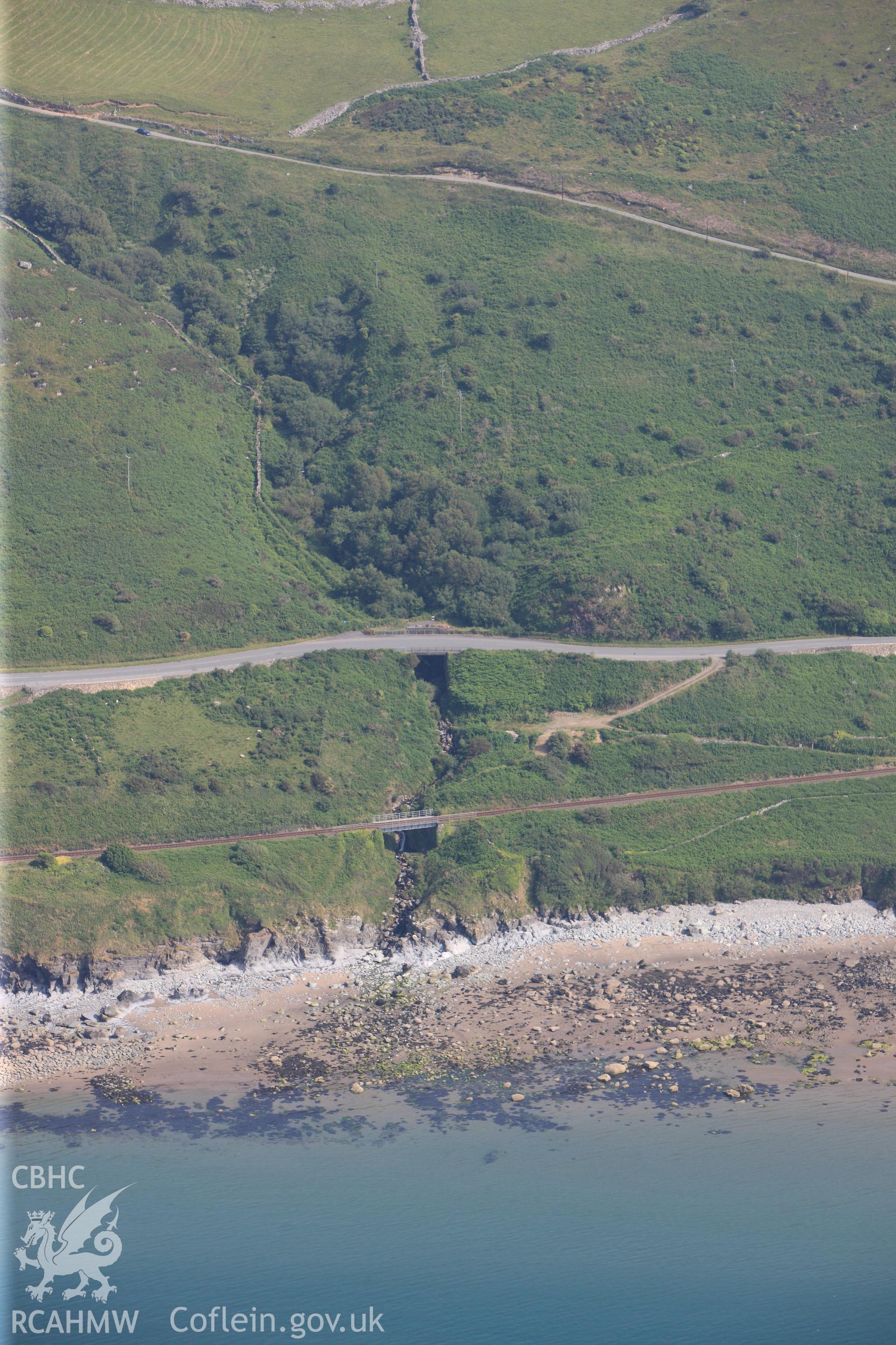 Section of the Cambrian Coast railway line near Llwyngwril, grid ref: SH600 110. Oblique aerial photograph taken during the Royal Commission?s programme of archaeological aerial reconnaissance by Toby Driver on 12th July 2013.