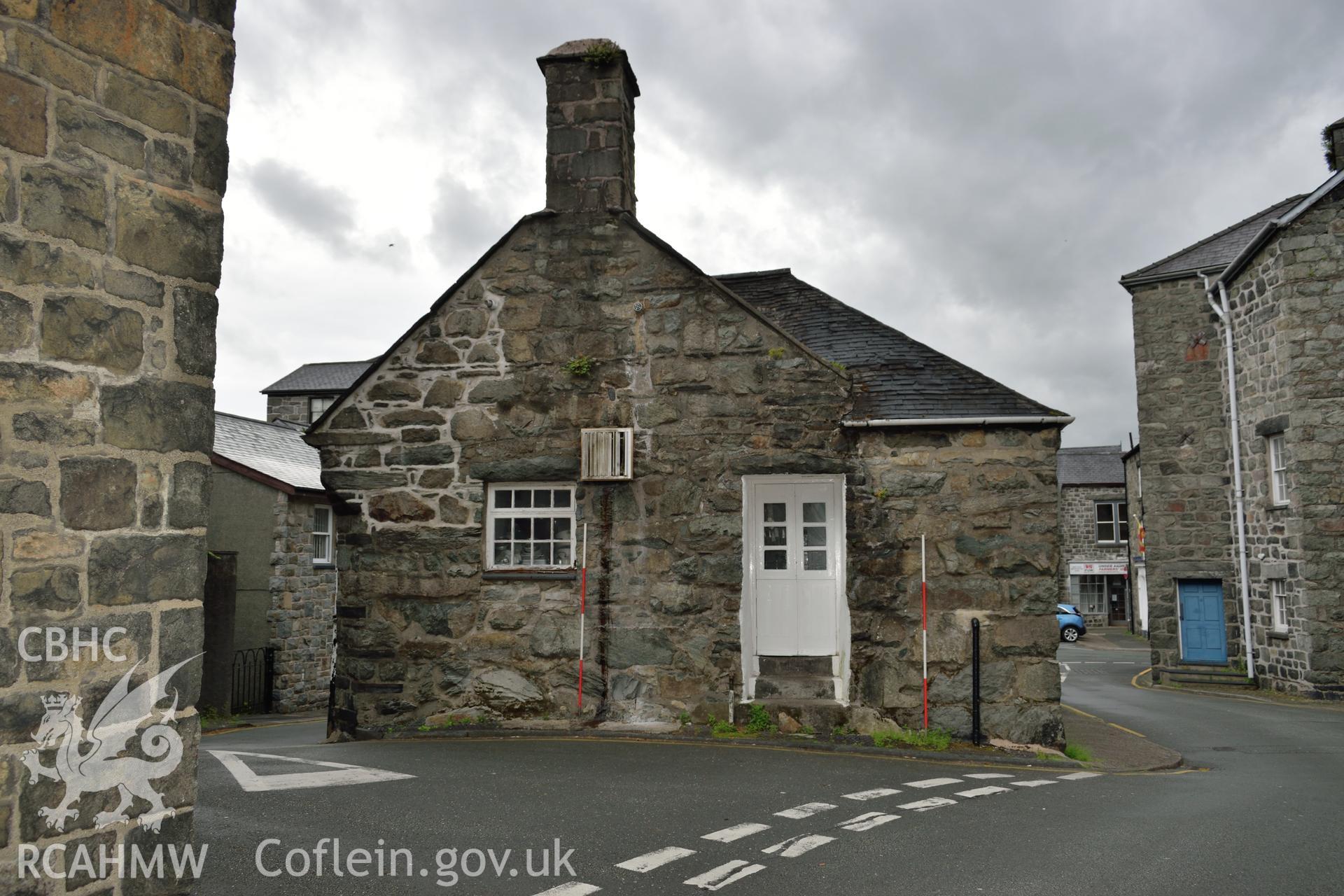 Colour photograph showing view looking east at the western elevation of Y Sospan, Llys Owain, Dolgellau. Photographed by I. P. Brookes of Engineering Archaeological Services, June 2019.