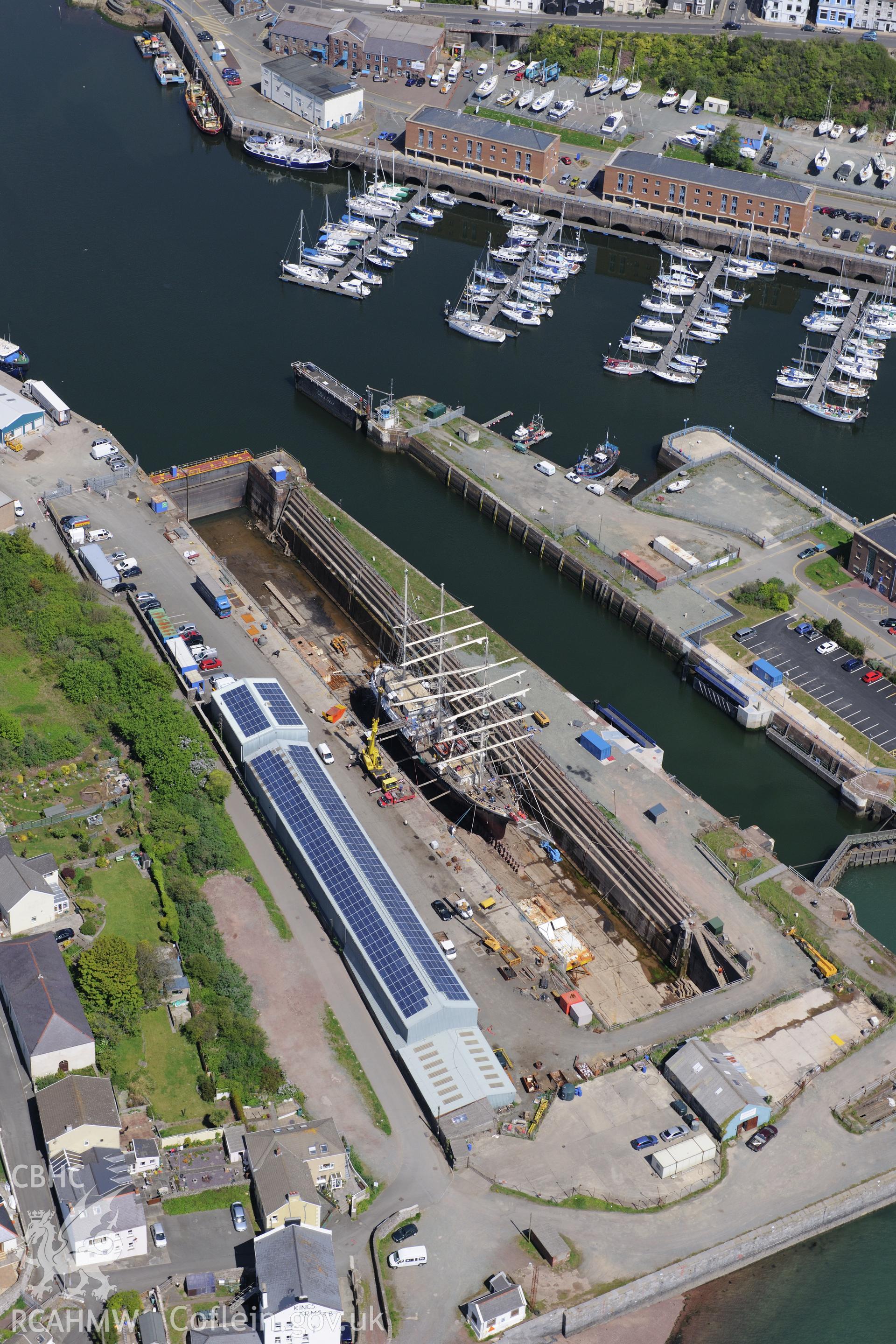 Milford Haven Docks. Oblique aerial photograph taken during the Royal Commission's programme of archaeological aerial reconnaissance by Toby Driver on 13th May 2015.