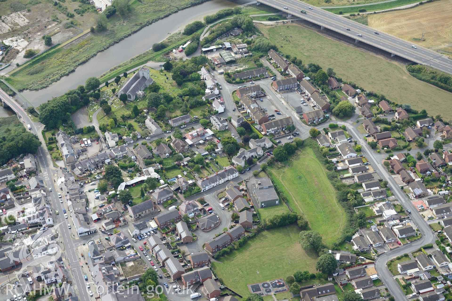 St. Mary's church and Rhuddlan bridge, Rhuddlan. Oblique aerial photograph taken during the Royal Commission's programme of archaeological aerial reconnaissance by Toby Driver on 11th September 2015.