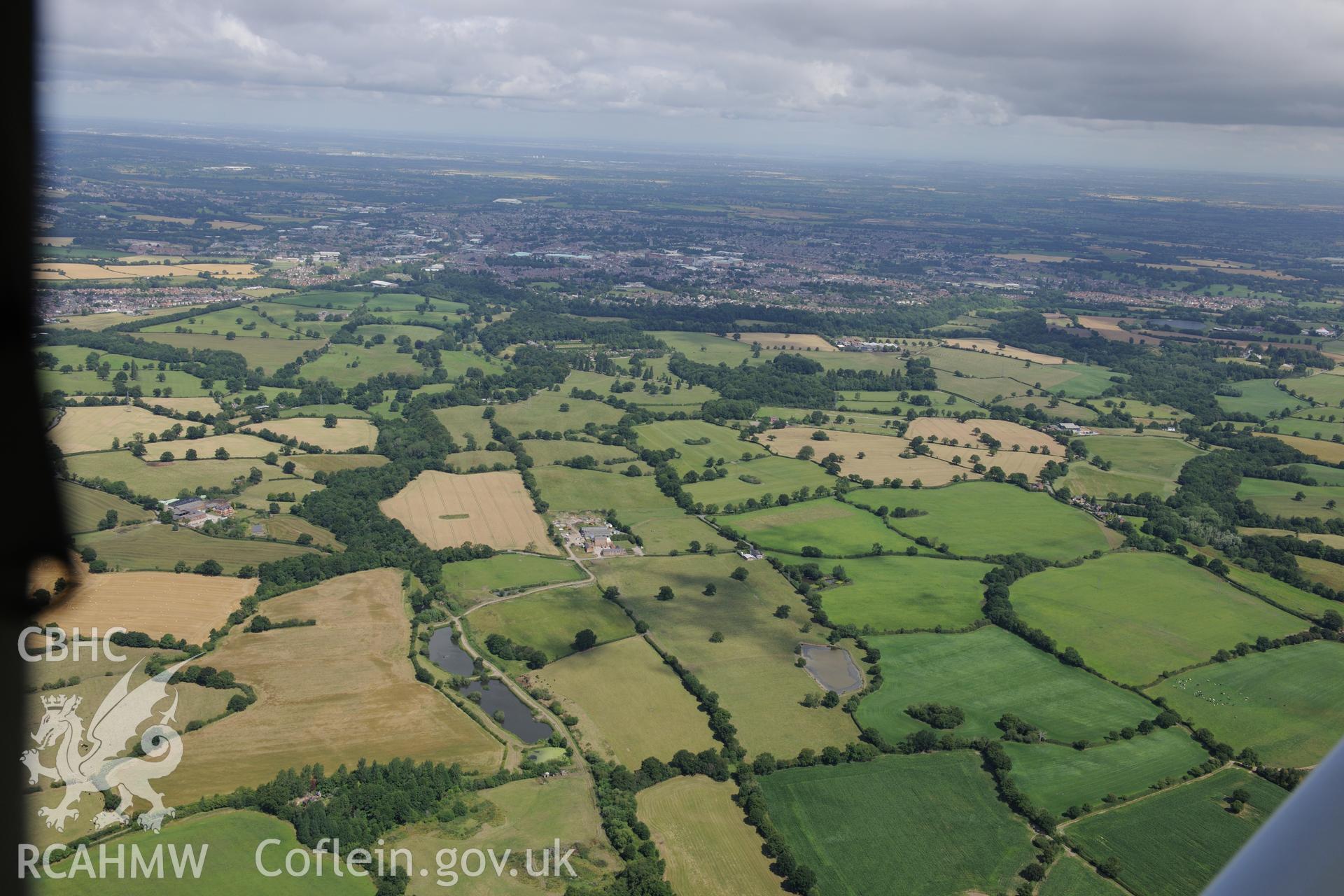 Middle Sontley Farm and the section of Wat's Dyke extending from Middle Sontley to Black Brook Bridge. Oblique aerial photograph taken during the Royal Commission's programme of archaeological aerial reconnaissance by Toby Driver on 30th July 2015.