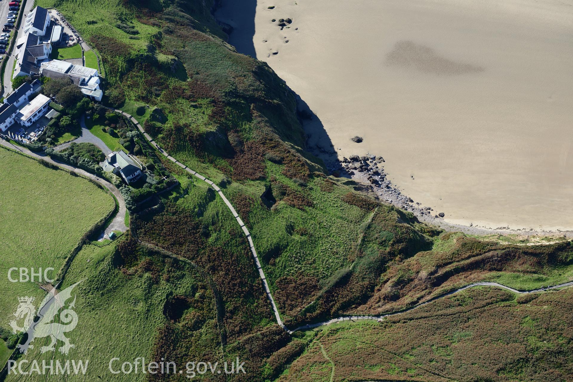 Rhossili Medieval Settlement, with the back of the Worms Head Hotel, on the western edge of the Gower Peninsula. Oblique aerial photograph taken during the Royal Commission's programme of archaeological aerial reconnaissance by Toby Driver on 30/09/2015.