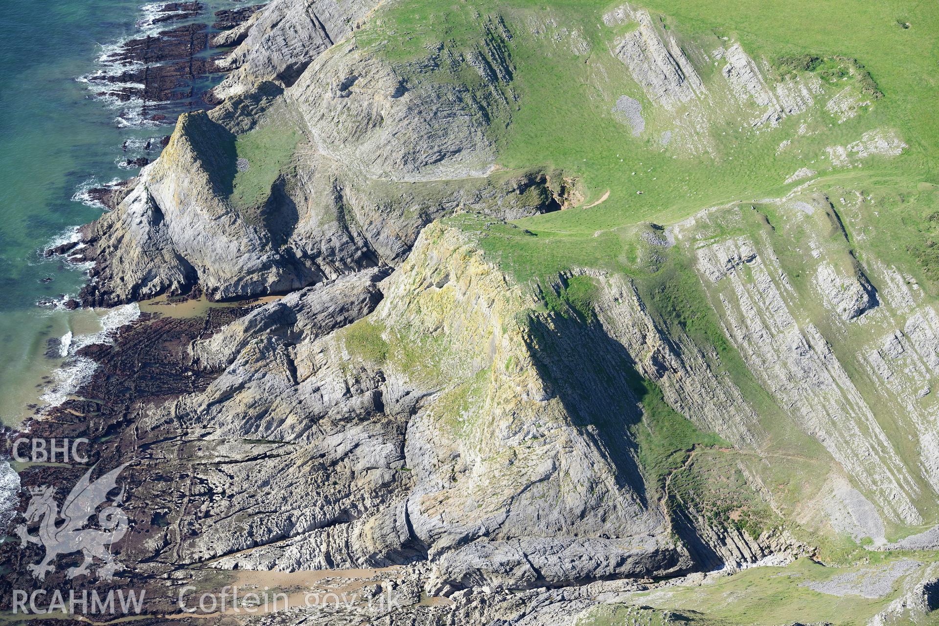 Horse Cliff promontory fort, on the south western shore of the Gower Peninsula. Oblique aerial photograph taken during the Royal Commission's programme of archaeological aerial reconnaissance by Toby Driver on 30th September 2015.