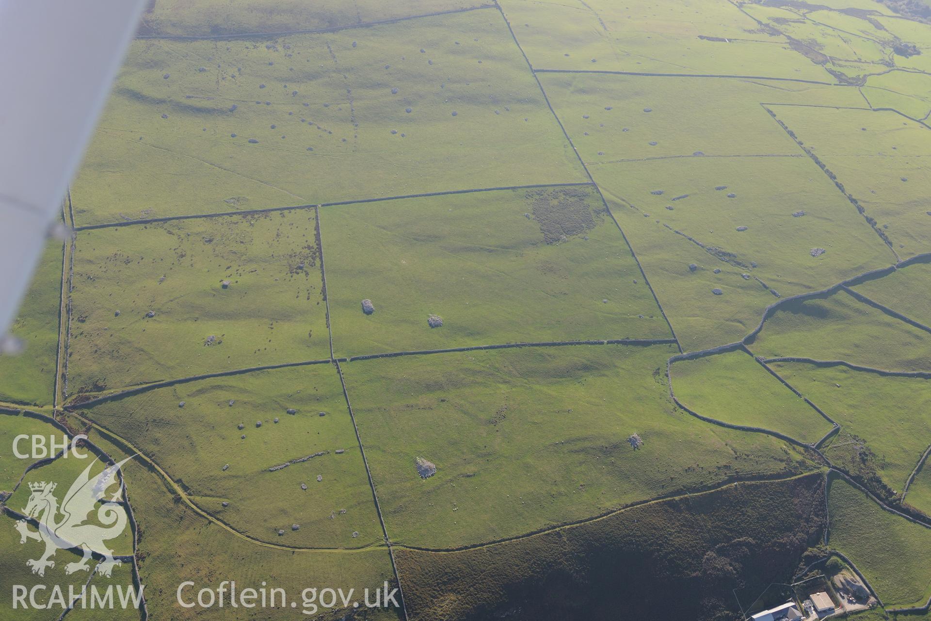 Parth-y-Gwddwch homestead and Gwastadgoed cairns and standing stones, near Llwyngwril. Oblique aerial photograph taken during the Royal Commission's programme of archaeological aerial reconnaissance by Toby Driver on 2nd October 2015.