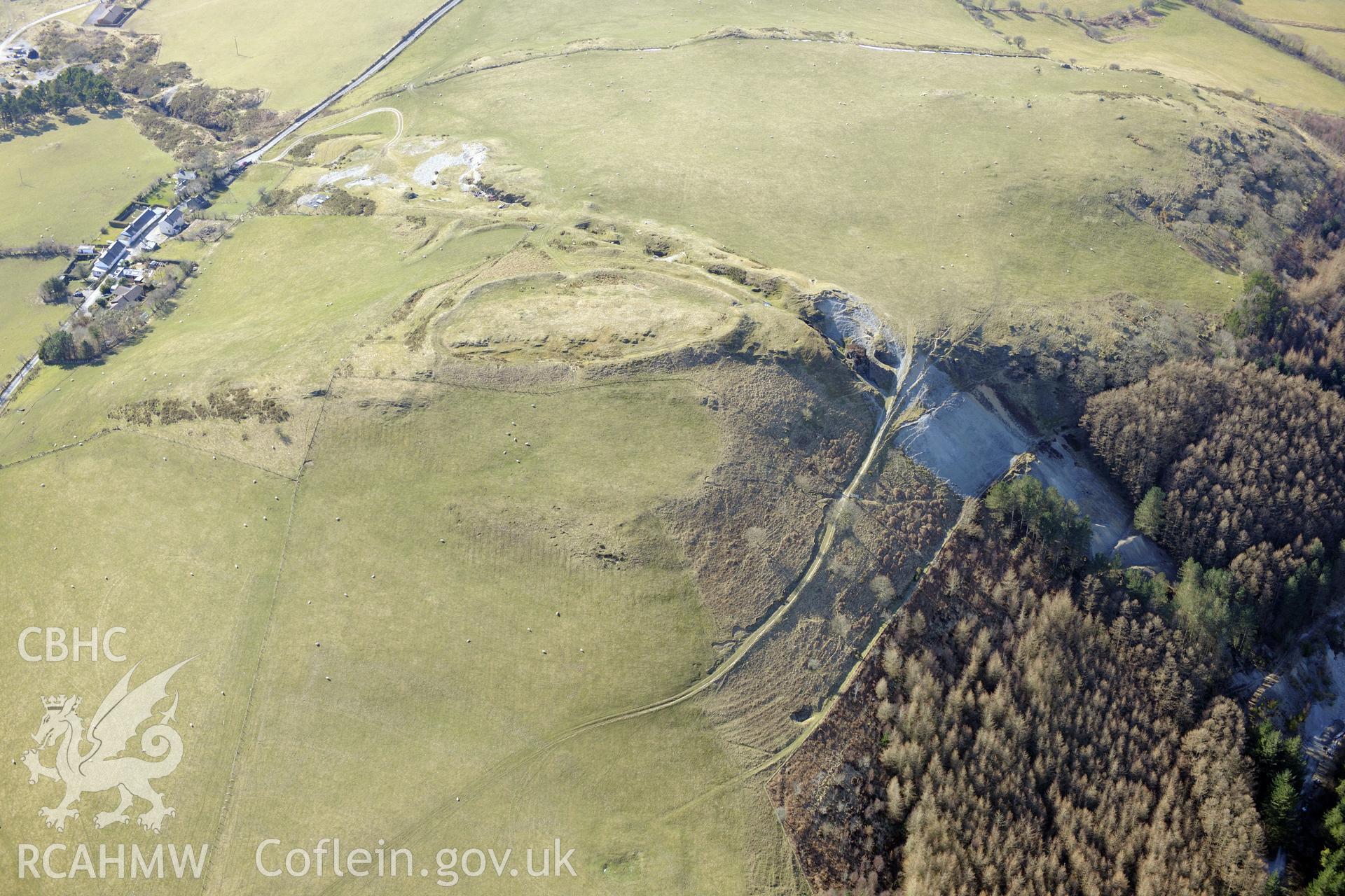 Darren camp hillfort in the centre, with Darren hamlet to the south west and Cwmsebon mine to the north east. Oblique aerial photograph taken during the Royal Commission?s programme of archaeological aerial reconnaissance by Toby Driver on 2nd April 2015.