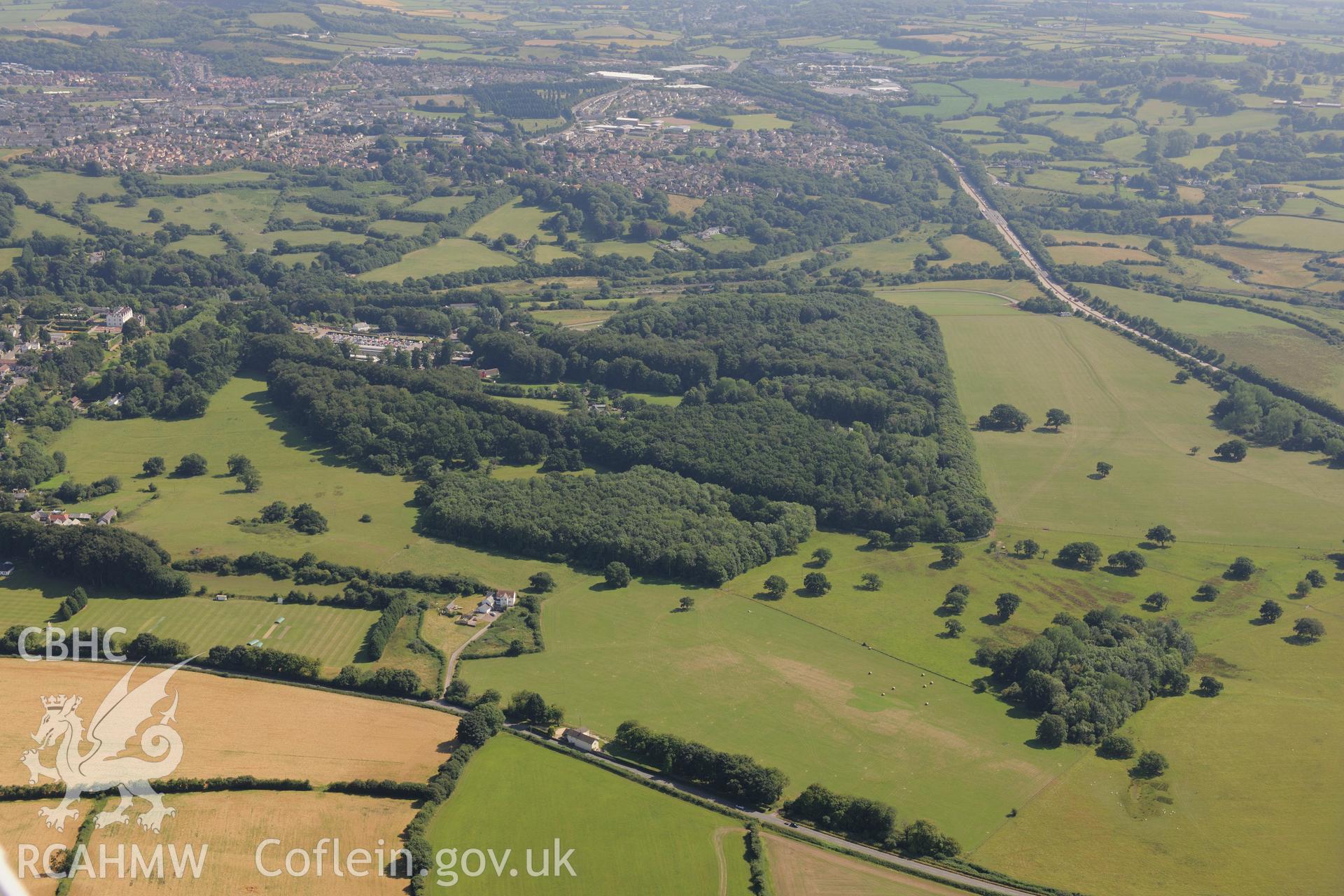 Tynewydd barrow cemetery, with St. Fagans National Museum of History & then the outskirts of Cardiff beyond. Oblique aerial photograph taken during the Royal Commission?s programme of archaeological aerial reconnaissance by Toby Driver on 1st August 2013.