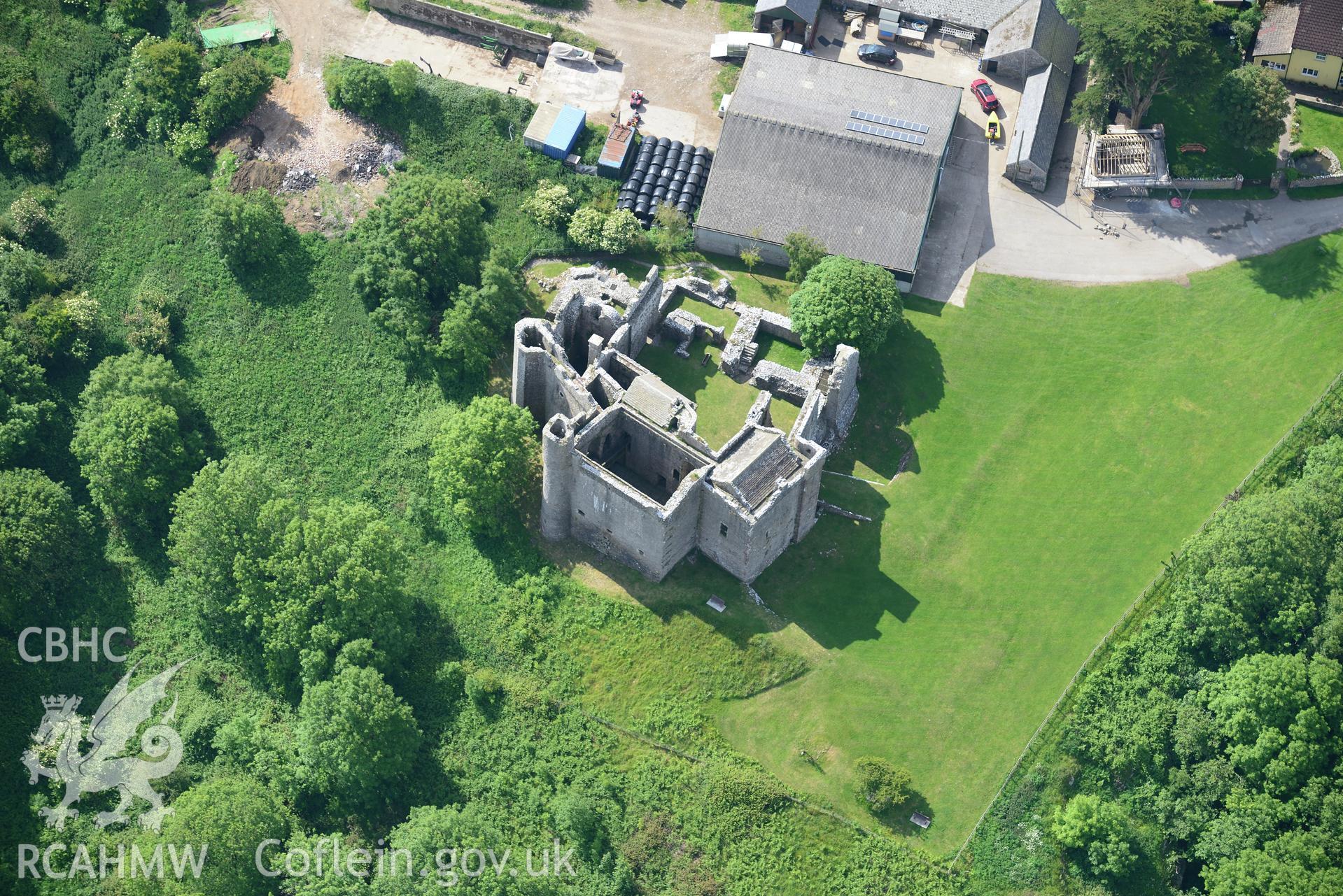 Wallas farm and earthworks showing the remains of Weobley Castle. Oblique aerial photograph taken during the Royal Commission's programme of archaeological aerial reconnaissance by Toby Driver on 19th June 2015.