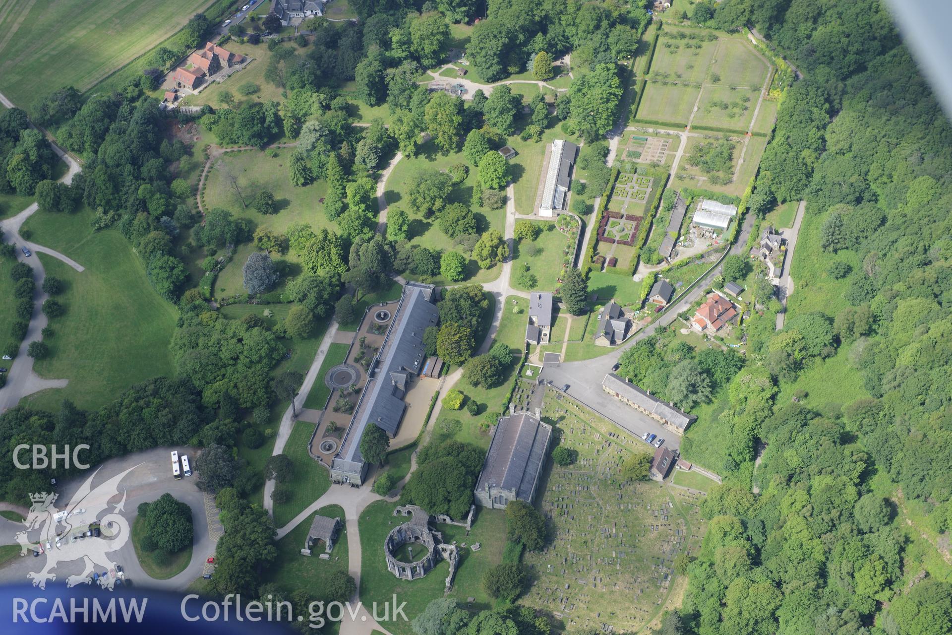 Margam Abbey including St. Mary's church; Chapter House; Orangery and garden. Oblique aerial photograph taken during the Royal Commission's programme of archaeological aerial reconnaissance by Toby Driver on 19th June 2015.