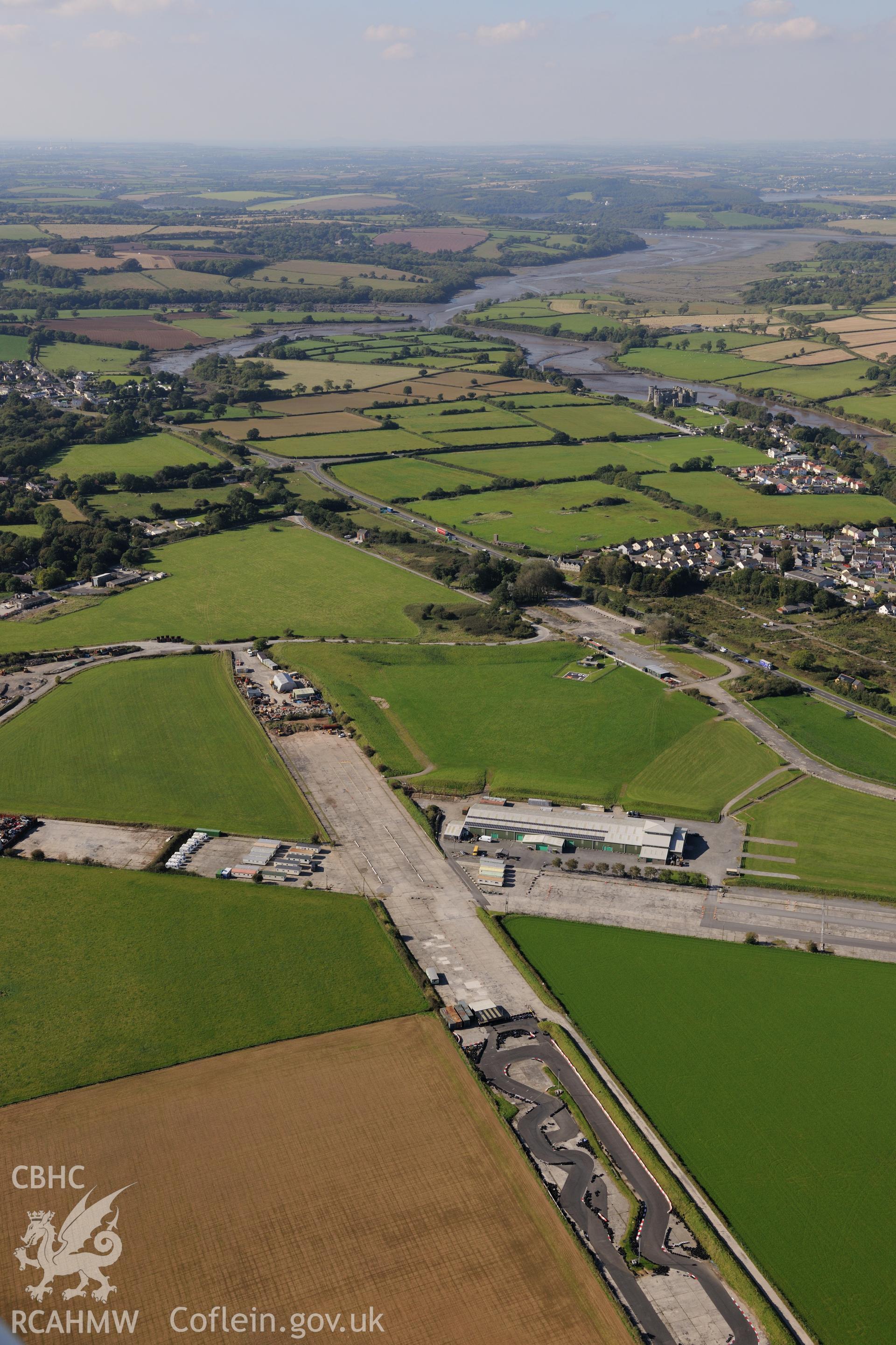 Carew Cheriton Airfield. Oblique aerial photograph taken during the Royal Commission's programme of archaeological aerial reconnaissance by Toby Driver on 30th September 2015.