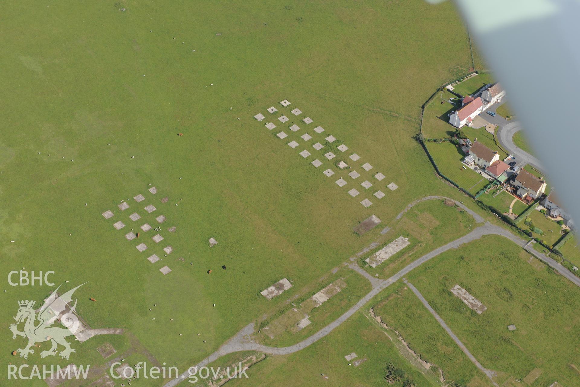 Tywyn airfield, the battle headquarters at Tywyn and the town of Tywyn. Oblique aerial photograph taken during RCAHMW?s programme of archaeological aerial reconnaissance by Toby Driver, 12th July 2013.