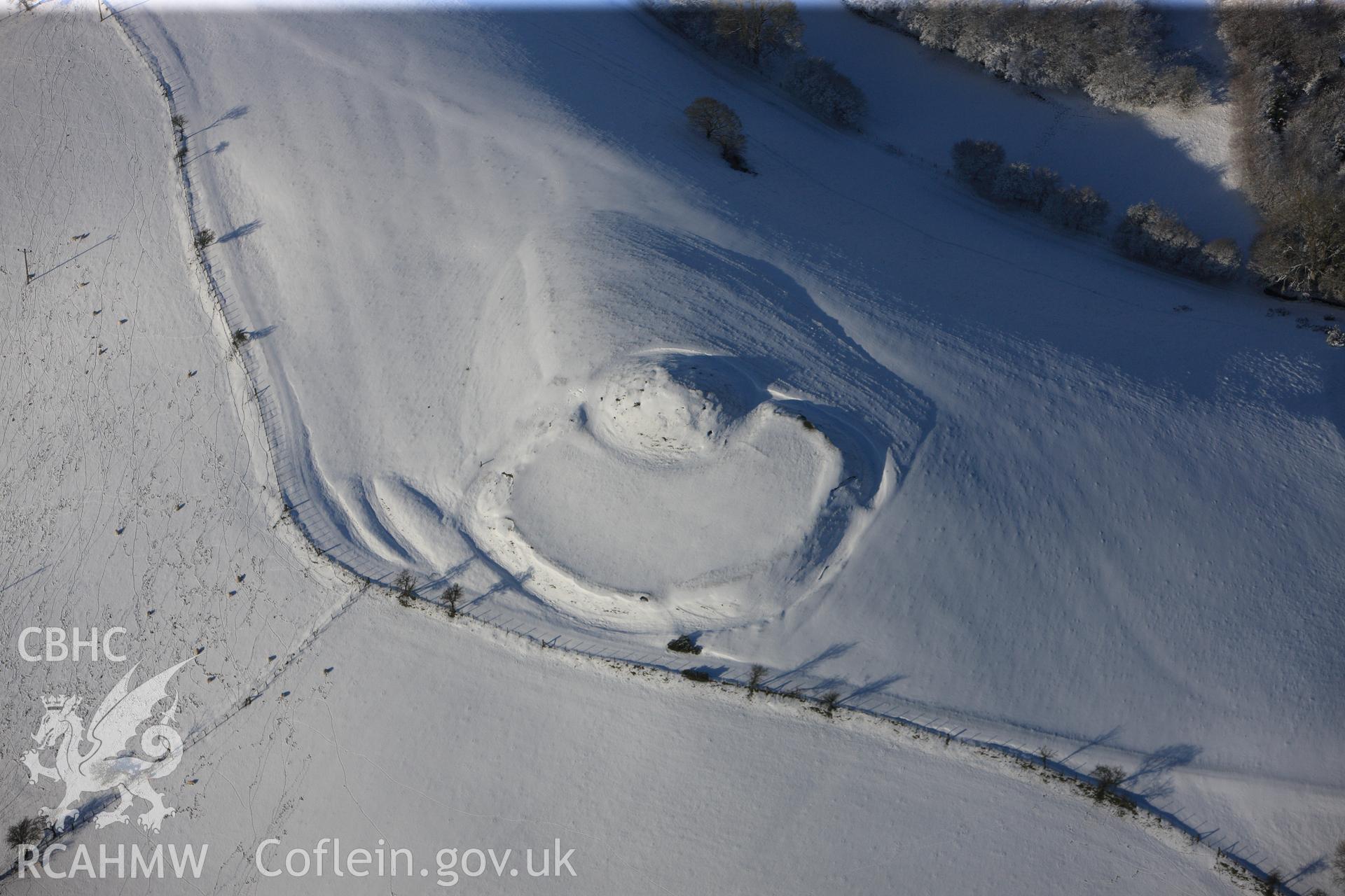 Castell Crugerydd motte and bailey, south east of Llandrindod Wells. Oblique aerial photograph taken during the Royal Commission?s programme of archaeological aerial reconnaissance by Toby Driver on 15th January 2013.