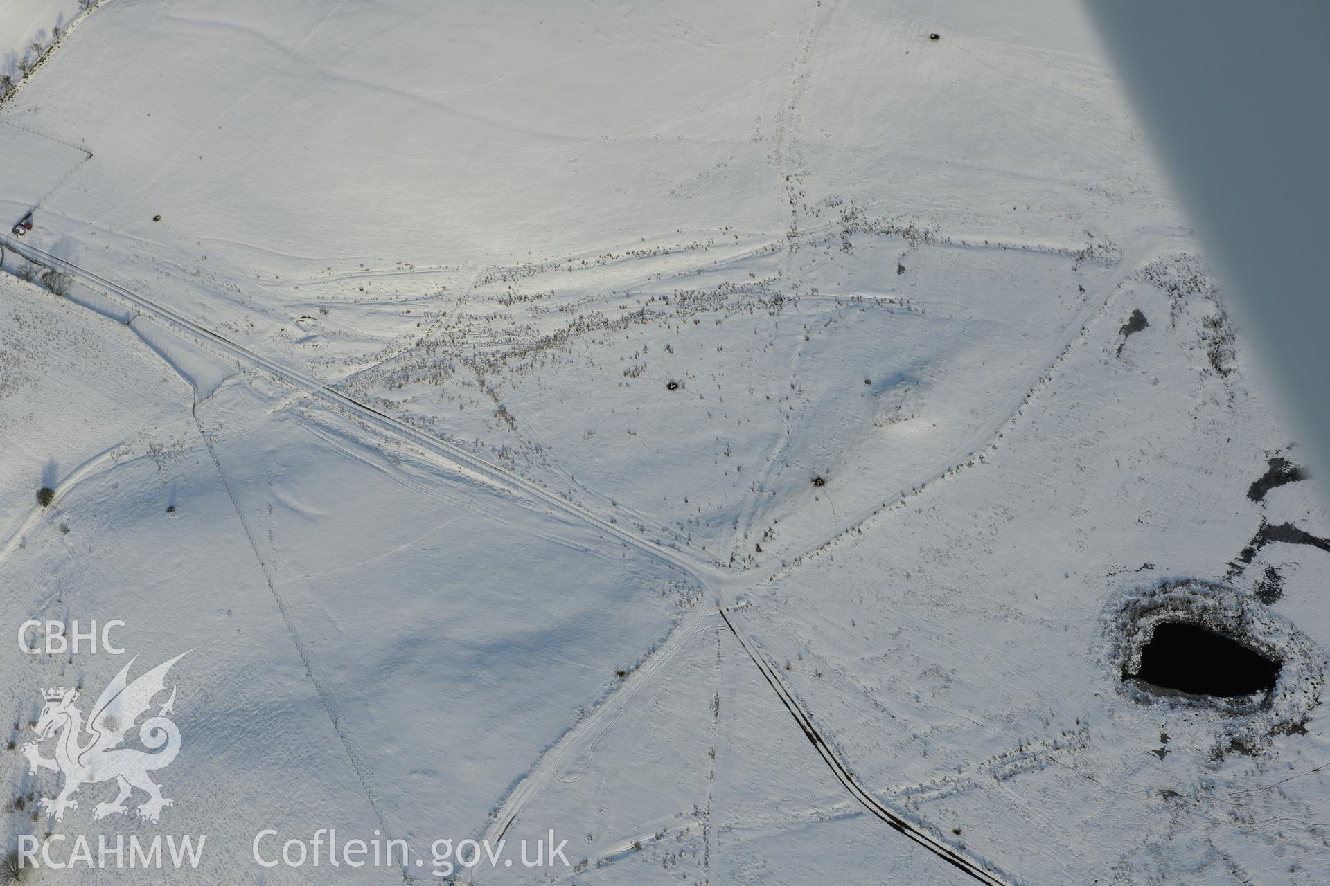 Bryn-y-Maen barrow and Four Stones pillow mound or stone alignment, Bryn-y-Maen, New Radnor. Oblique aerial photograph taken during the Royal Commission?s programme of archaeological aerial reconnaissance by Toby Driver on 15th January 2013.