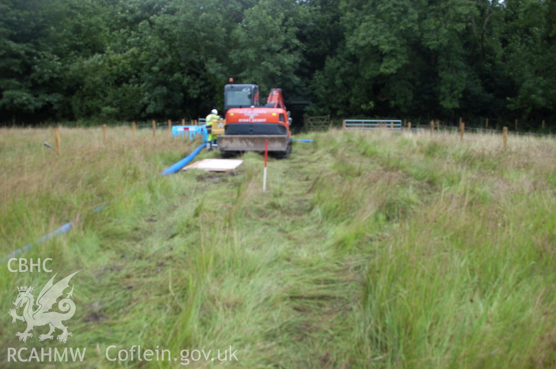 Digital photograph showing view from south of launch pit 1's general location. Photographed during Gwynedd Archaeological Trust's archaeological watching brief of water main renewal in Dolgellau on 28th July 2017. Project no. G2528.