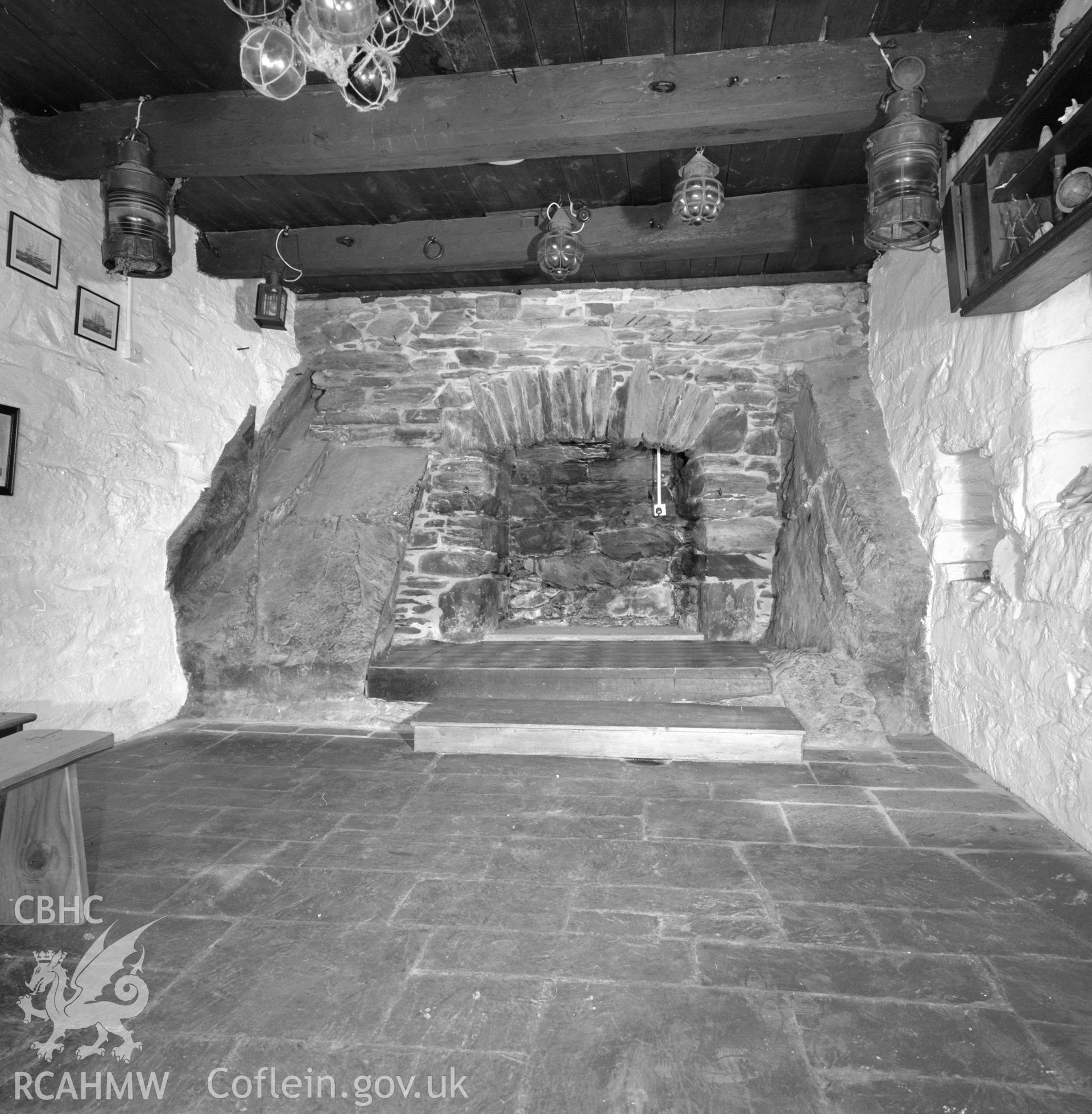 Digital copy of a black and white negative showing the fireplace at Ty Gwyn, Barmouth taken by RCAHMW.