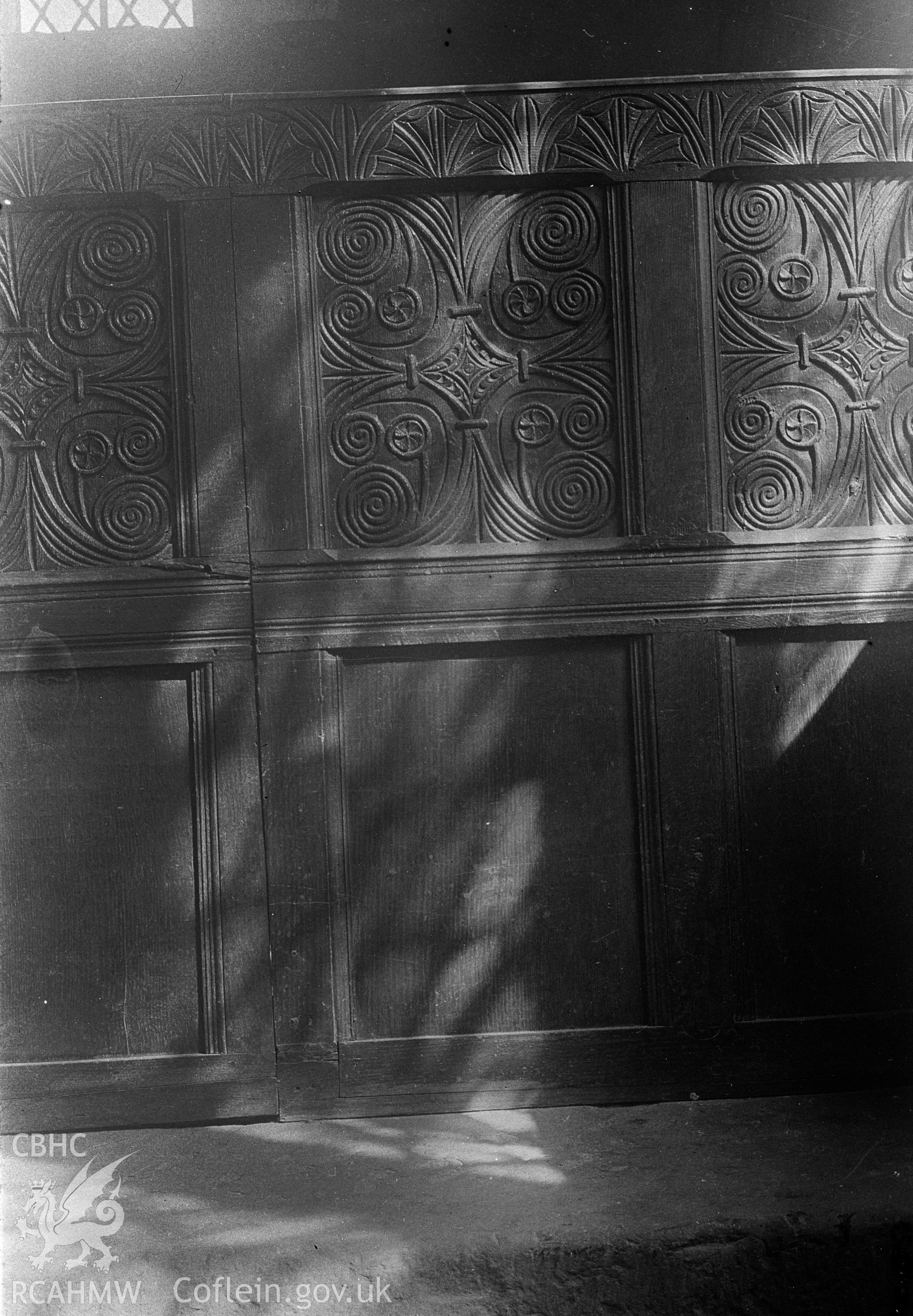 Digital copy of a nitrate negative showing carved wood panelling at the church at the Skenfrith Castle site taken by Leonard Monroe.