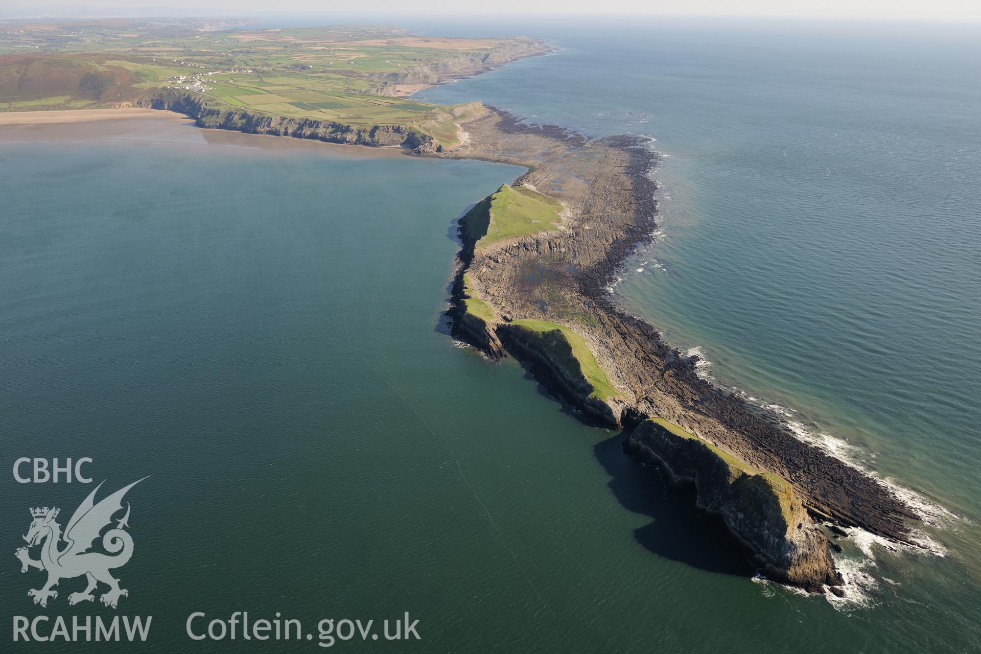 Worm's Head, the enclosure on its north eastern side and Worm Sound, on western coast of Gower Peninsula. Oblique aerial photograph taken during the Royal Commission's programme of archaeological aerial reconnaissance by Toby Driver on 30th September 2015.