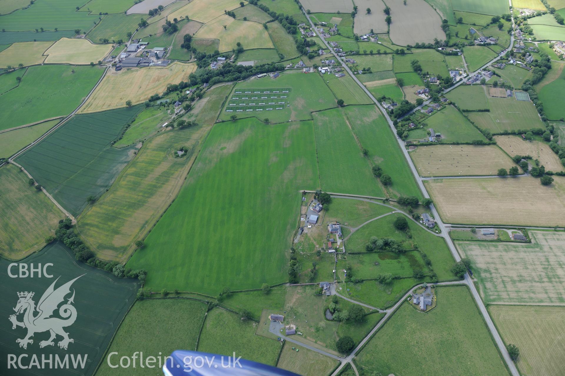 Forden and the section of Offa's Dyke from 90m south of Chirbury road to the southern boundary of Nant-Cribau park. Oblique aerial photograph taken during the Royal Commission's programme of archaeological aerial reconnaissance by Toby Driver on 30/6/2015.