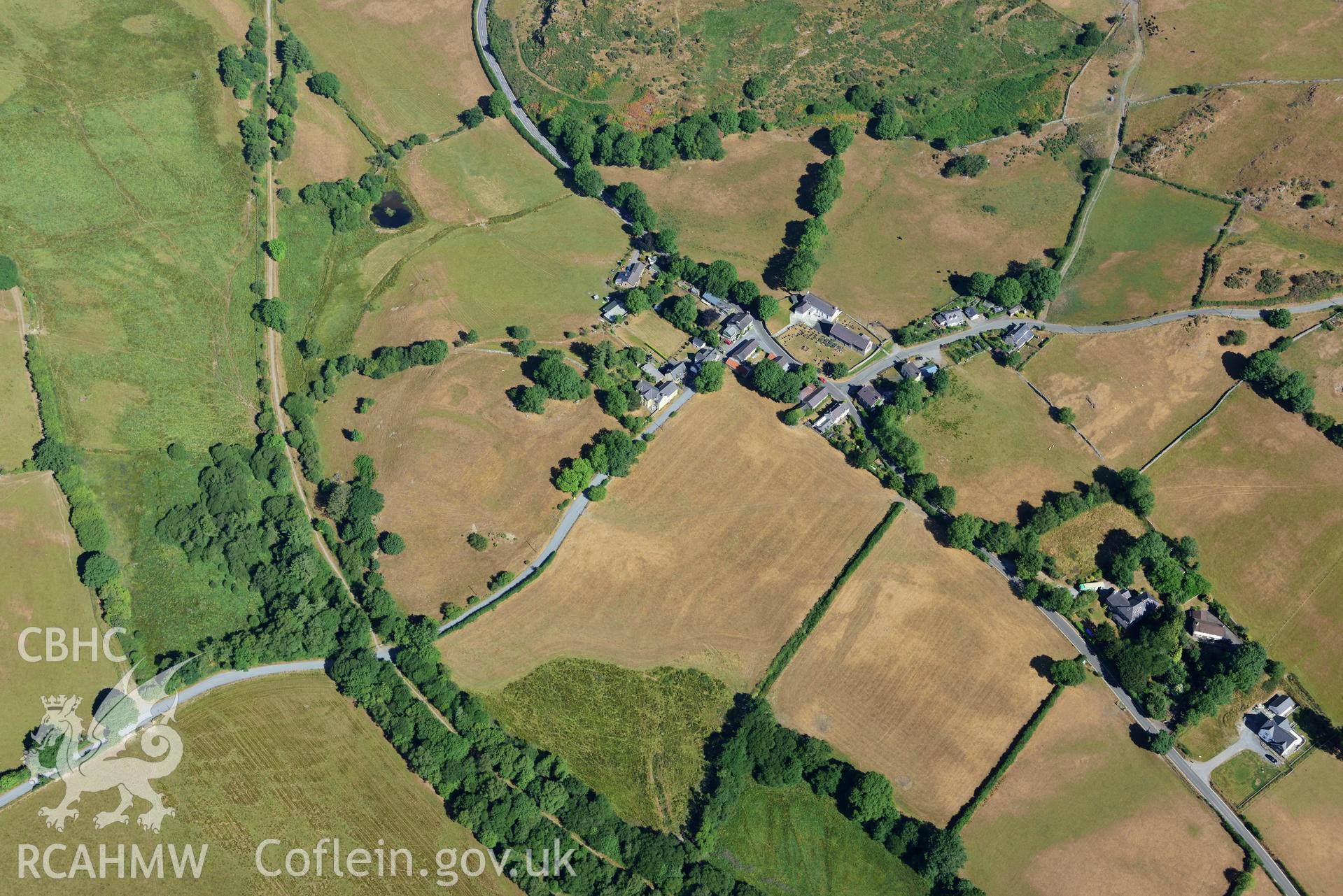 Royal Commission aerial photography of Ystrad Meurig castle and village with extensive parching, taken on 19th July 2018 during the 2018 drought.