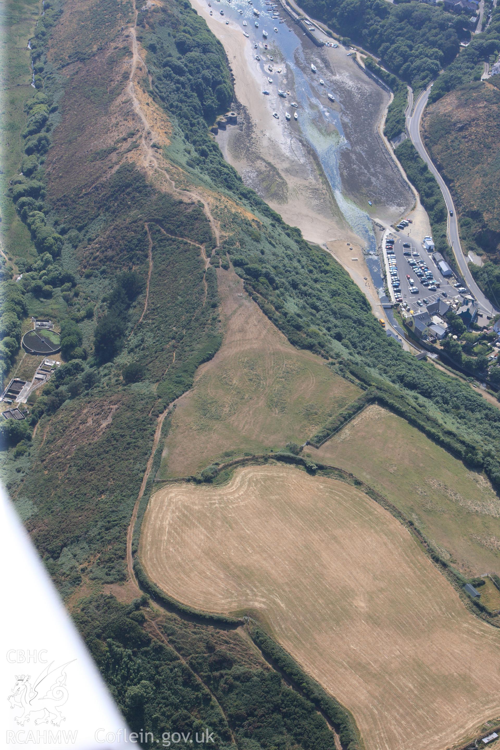 Defended enclosure at Solva. Oblique aerial photograph taken during the Royal Commission?s programme of archaeological aerial reconnaissance by Toby Driver on 16th July 2013.