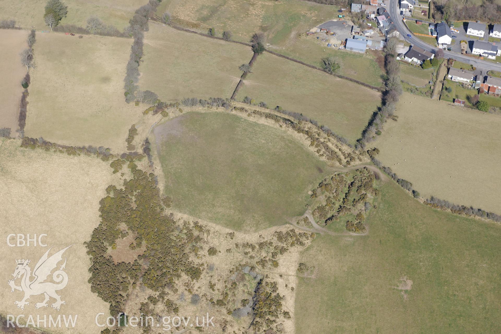 Gaer Maesmynach hillfort on the outskirts of Cribyn, north west of Lampeter. Oblique aerial photograph taken during the Royal Commission's programme of archaeological aerial reconnaissance by Toby Driver on 2nd April 2013.