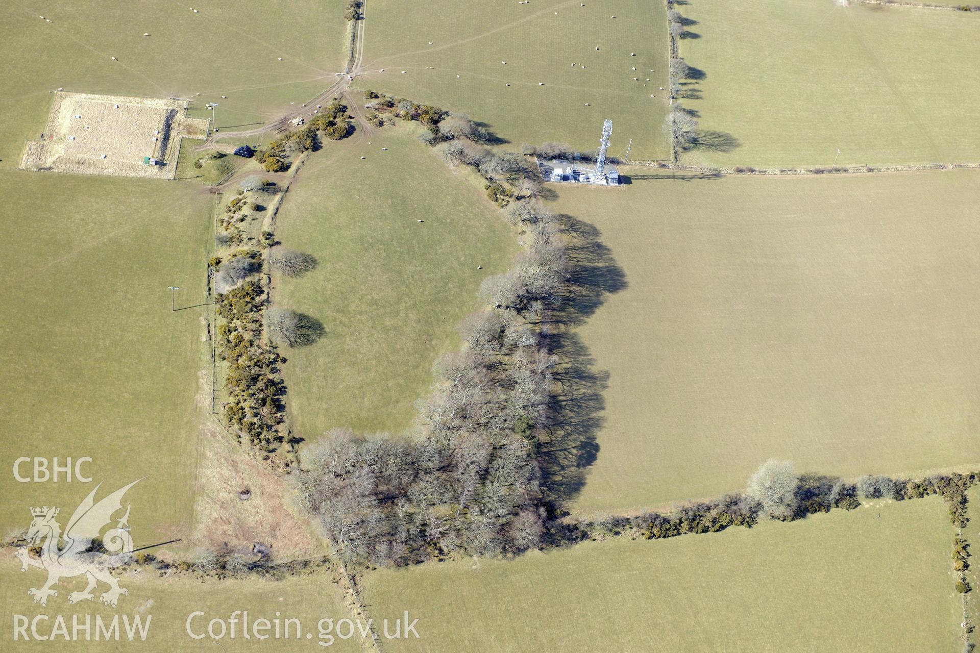 Hen Gaer hillfort, Bow Street, north east of Aberystwyth. Oblique aerial photograph taken during the Royal Commission's programme of archaeological aerial reconnaissance by Toby Driver on 2nd April 2013.