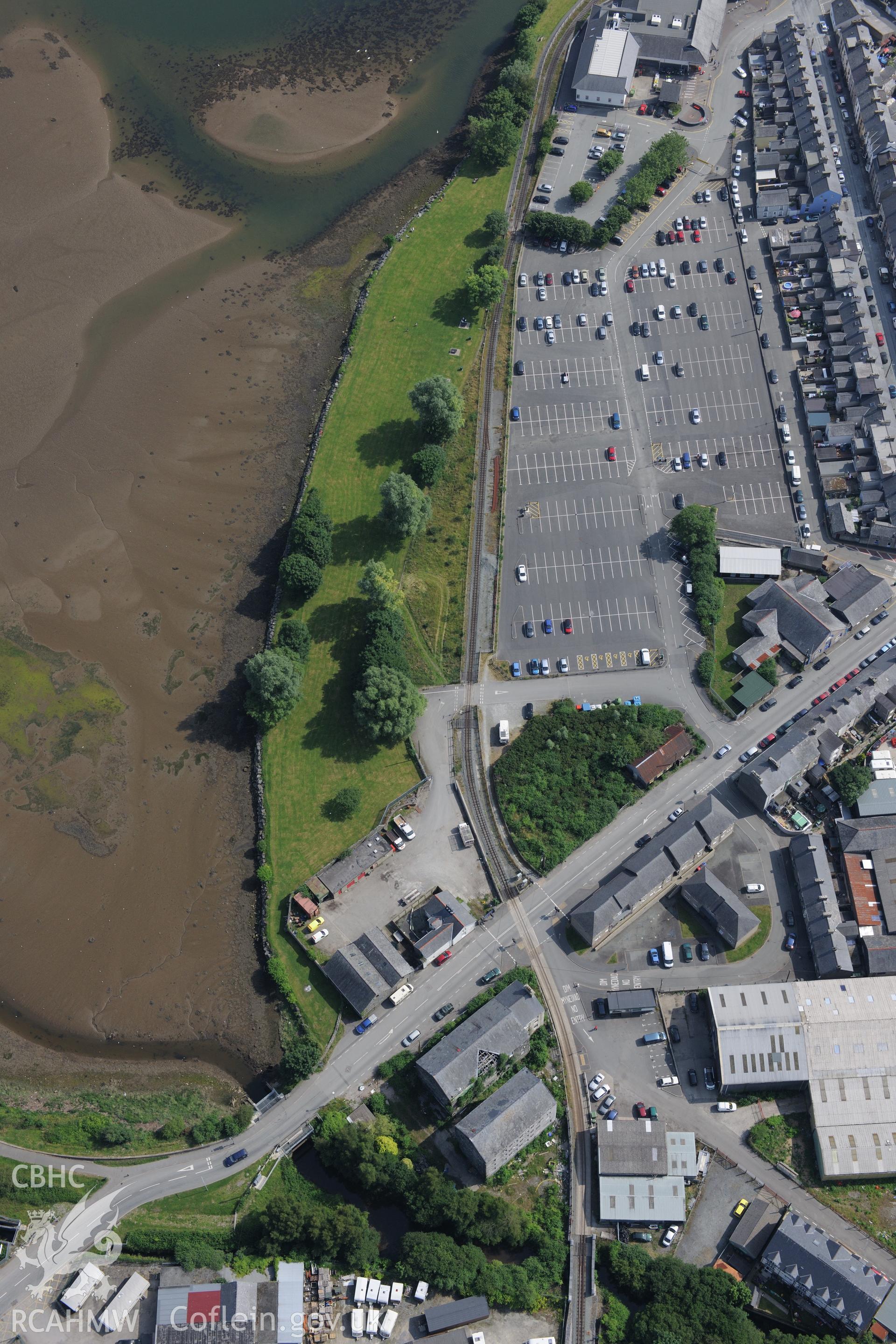 Snowdon Street Corn Mill, Porthmadog. Oblique aerial photograph taken during the Royal Commission?s programme of archaeological aerial reconnaissance by Toby Driver on 12th July 2013.